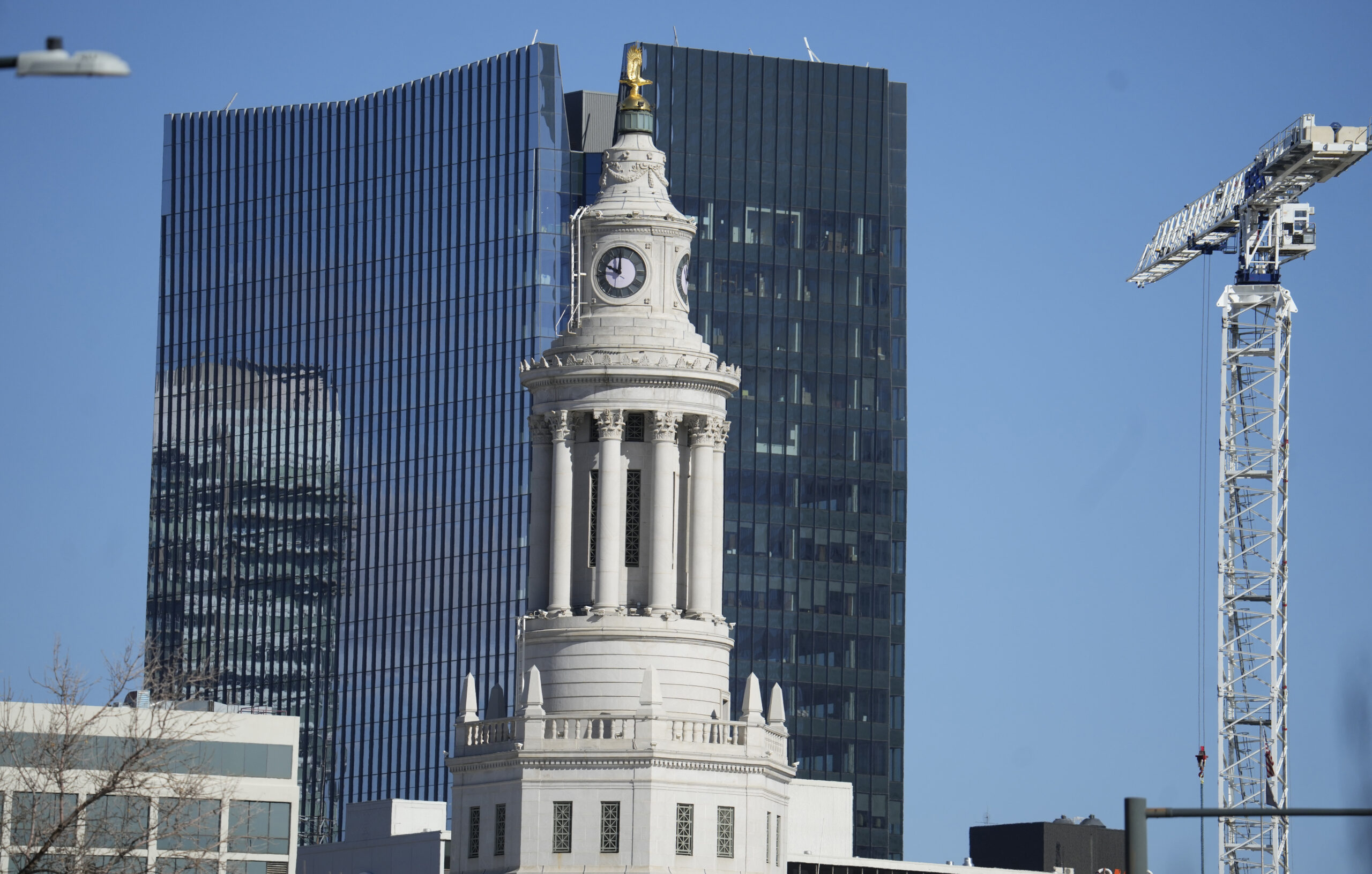 FILE - The tower from the Denver City/County Building, center, is flanked by a high rise office tow...