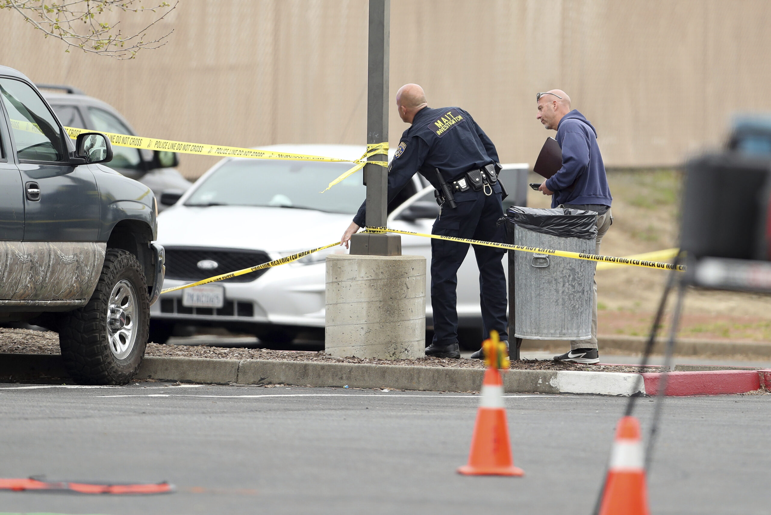 FILE - Police investigate a shooting near Mahany Park in Roseville, Calif., Thursday, April 6, 2023...