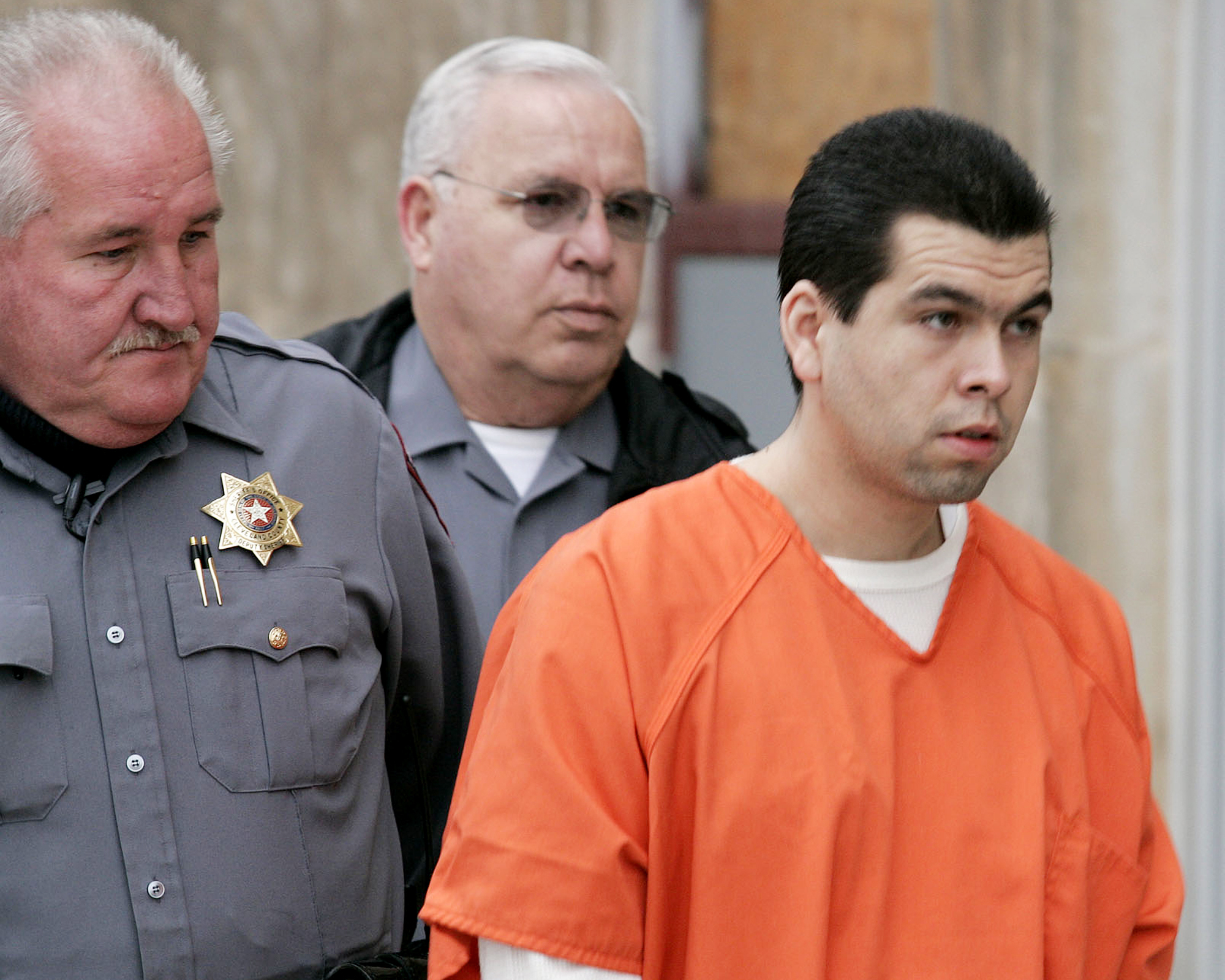 FILE - Anthony Sanchez, right, is escorted into a Cleveland County, Okla., courtroom for a prelimin...