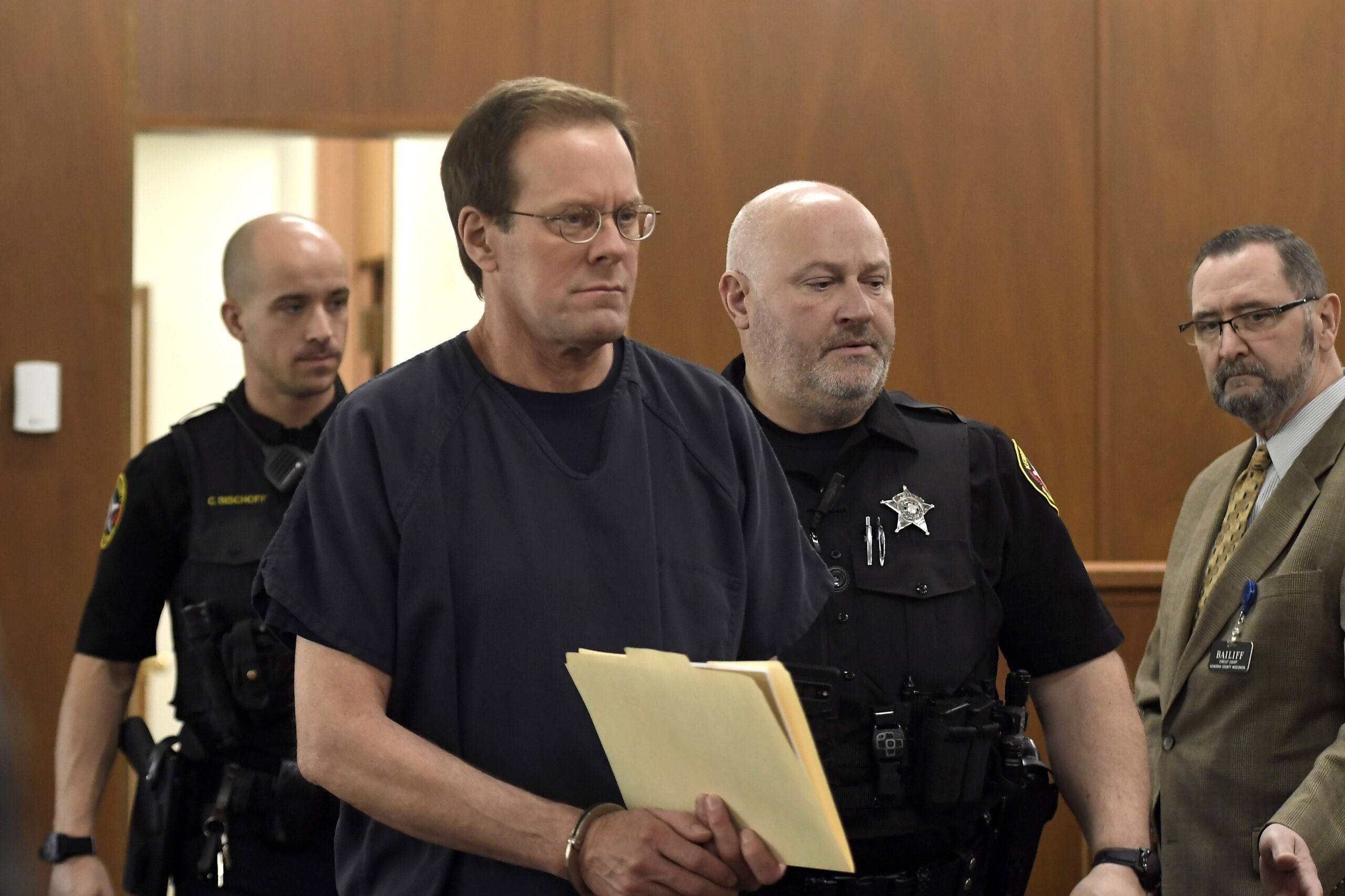 Mark Jensen makes his way into the courtroom for his sentencing hearing, Friday, April 14, 2023, in...