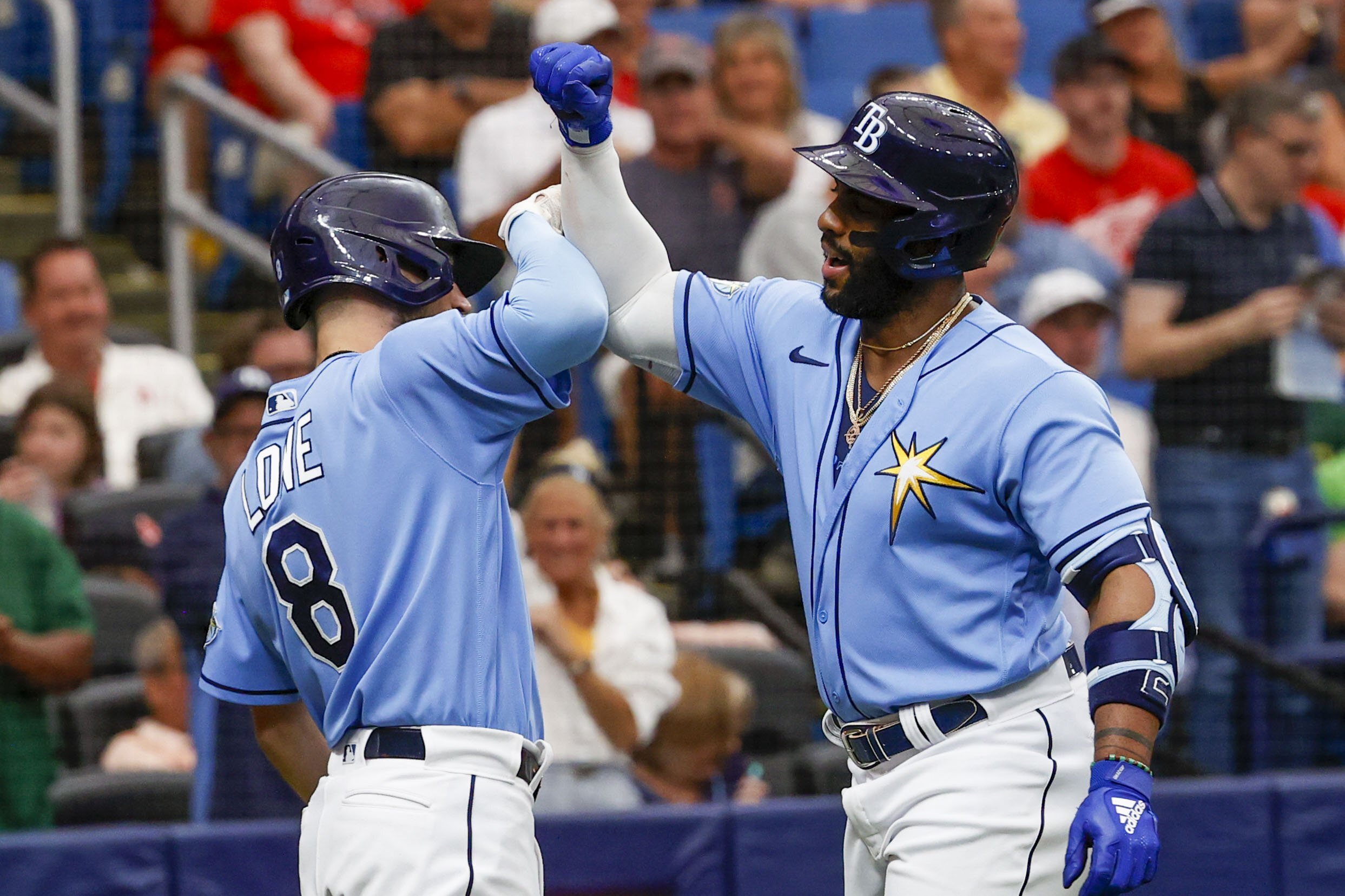 Tampa Bay Rays' Brandon Lowe (8) and Yandy Diaz (2) celebrate a solo home run in the first inning o...
