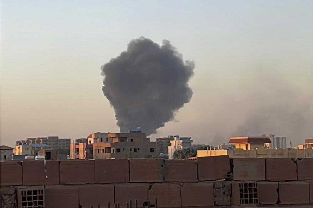 In this photo provided by Maheen S , smoke fills the sky in Khartoum, Sudan, near Doha Internationa...