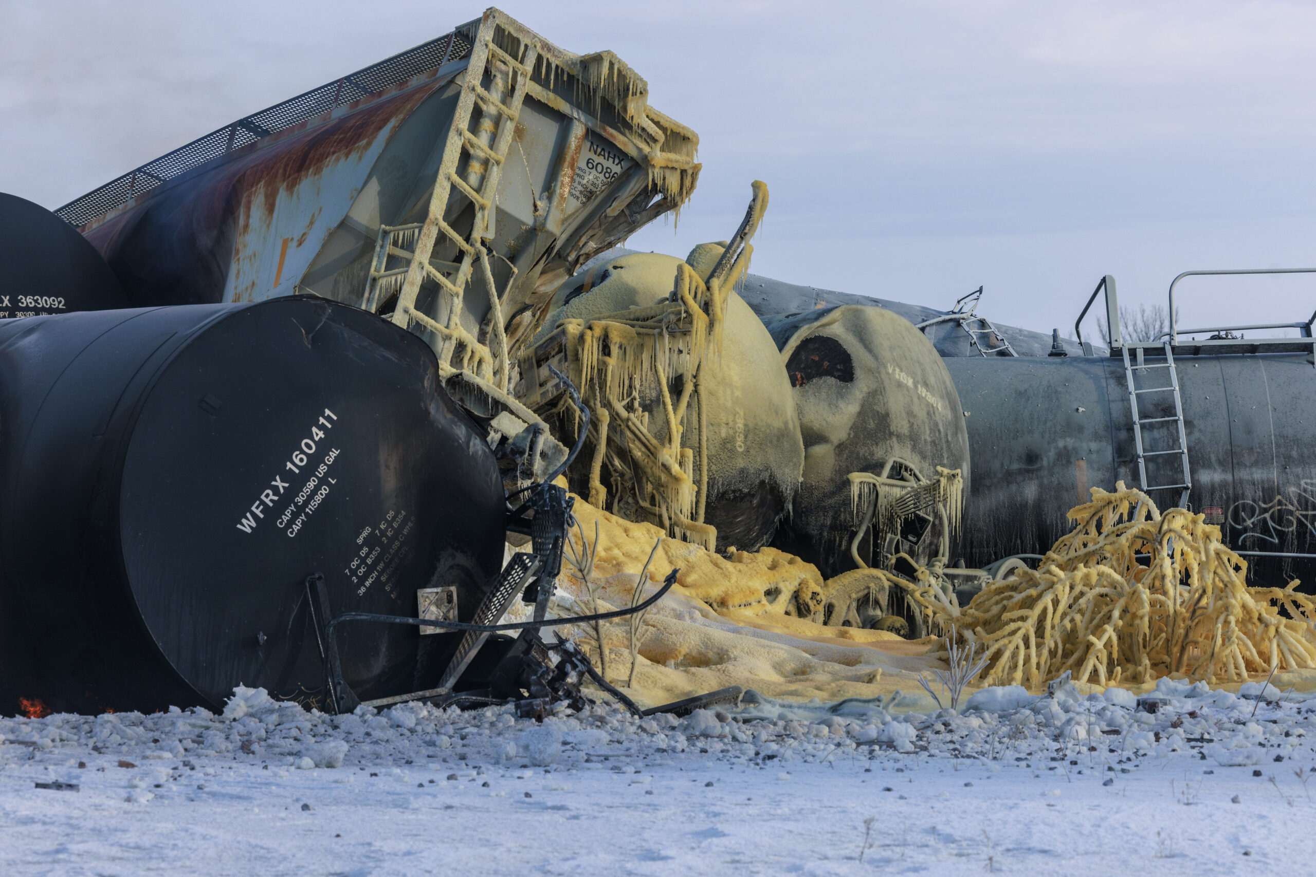 FILE - Train cars pile up after a BNSF freight train derailed on March 30, 2023, near Raymond, Minn...