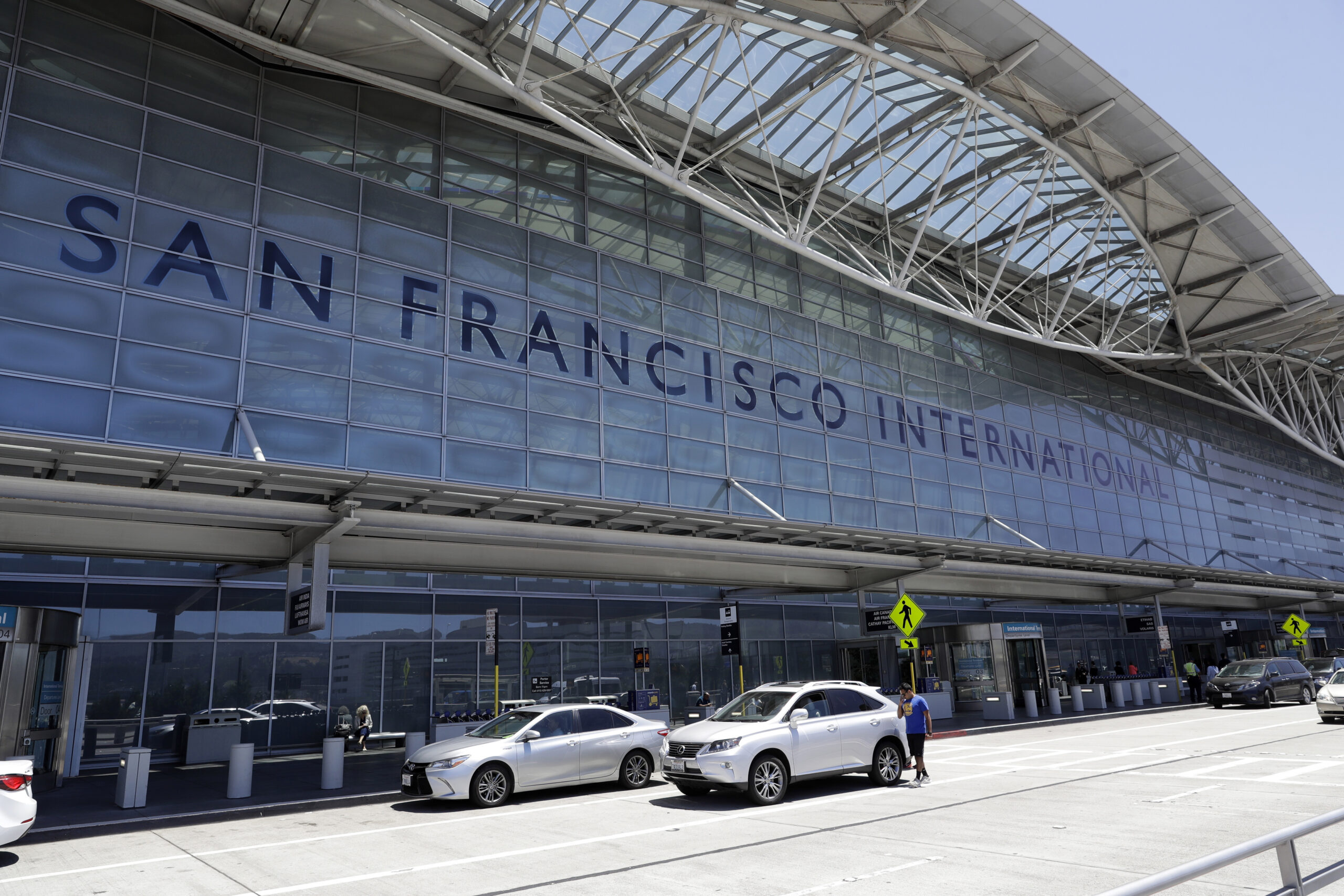 FILE - Vehicles wait outside the international terminal at San Francisco International Airport in S...