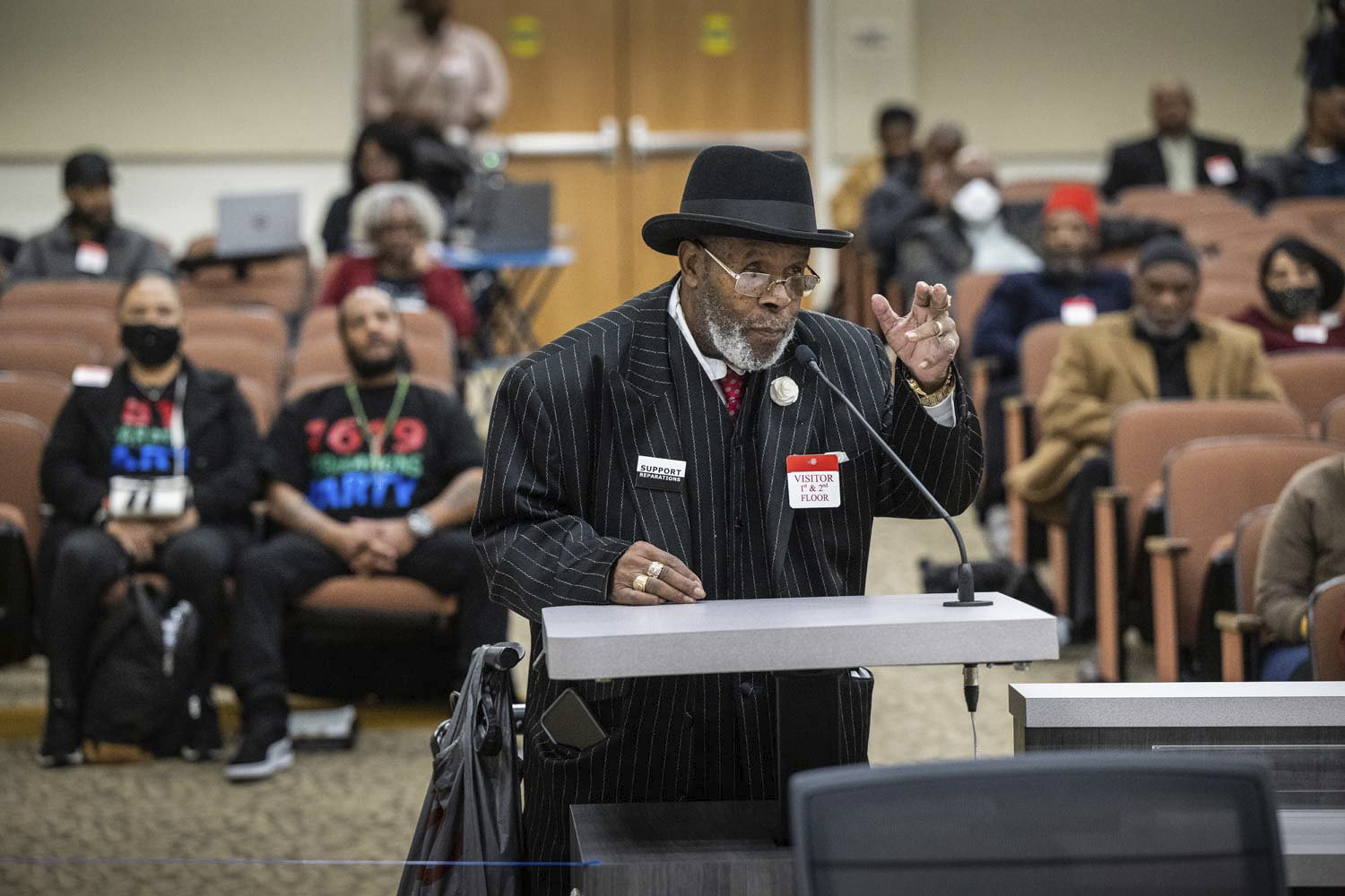 FILE - Bishop Henry C. Williams, of Oakland, testifies during the Reparations Task Force meeting in...