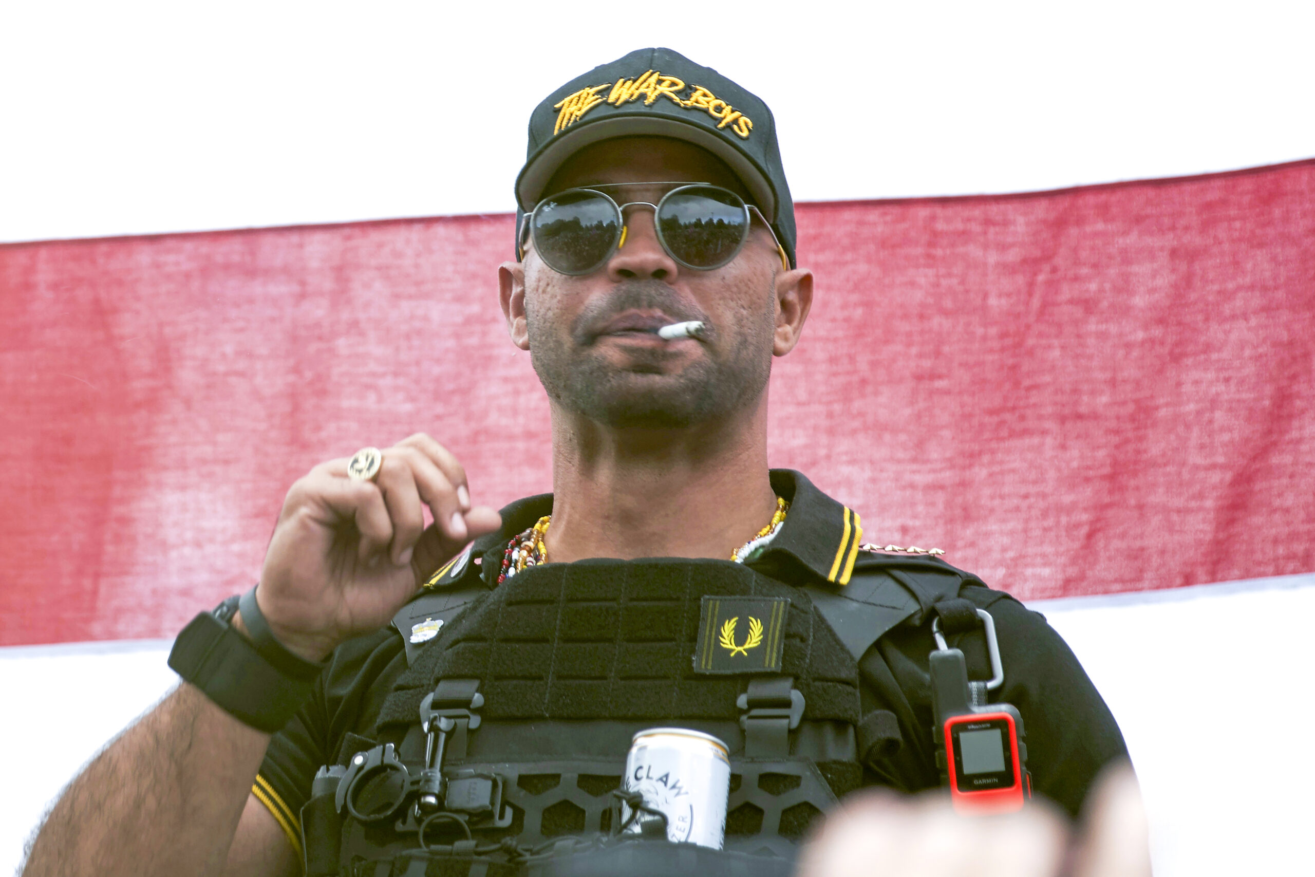FILE - Proud Boys leader Henry "Enrique" Tarrio wears a hat that says The War Boys during a rally i...