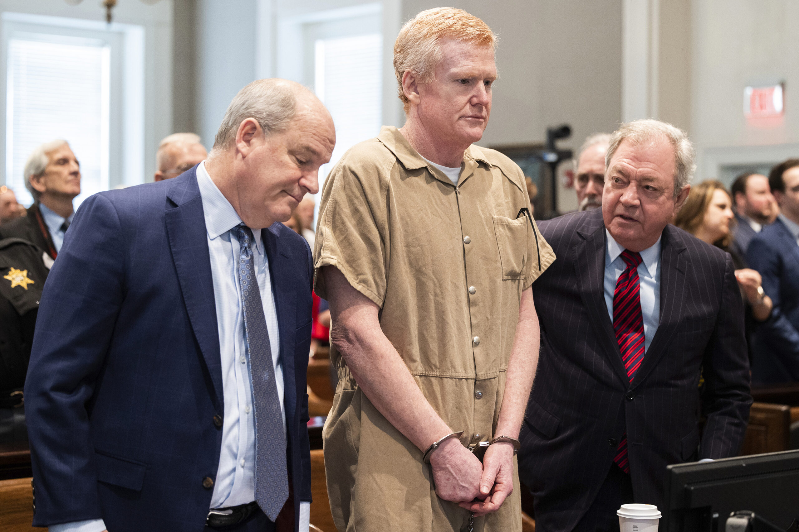 FILE - Alex Murdaugh speaks with his legal team before he is sentenced to two consecutive life sent...