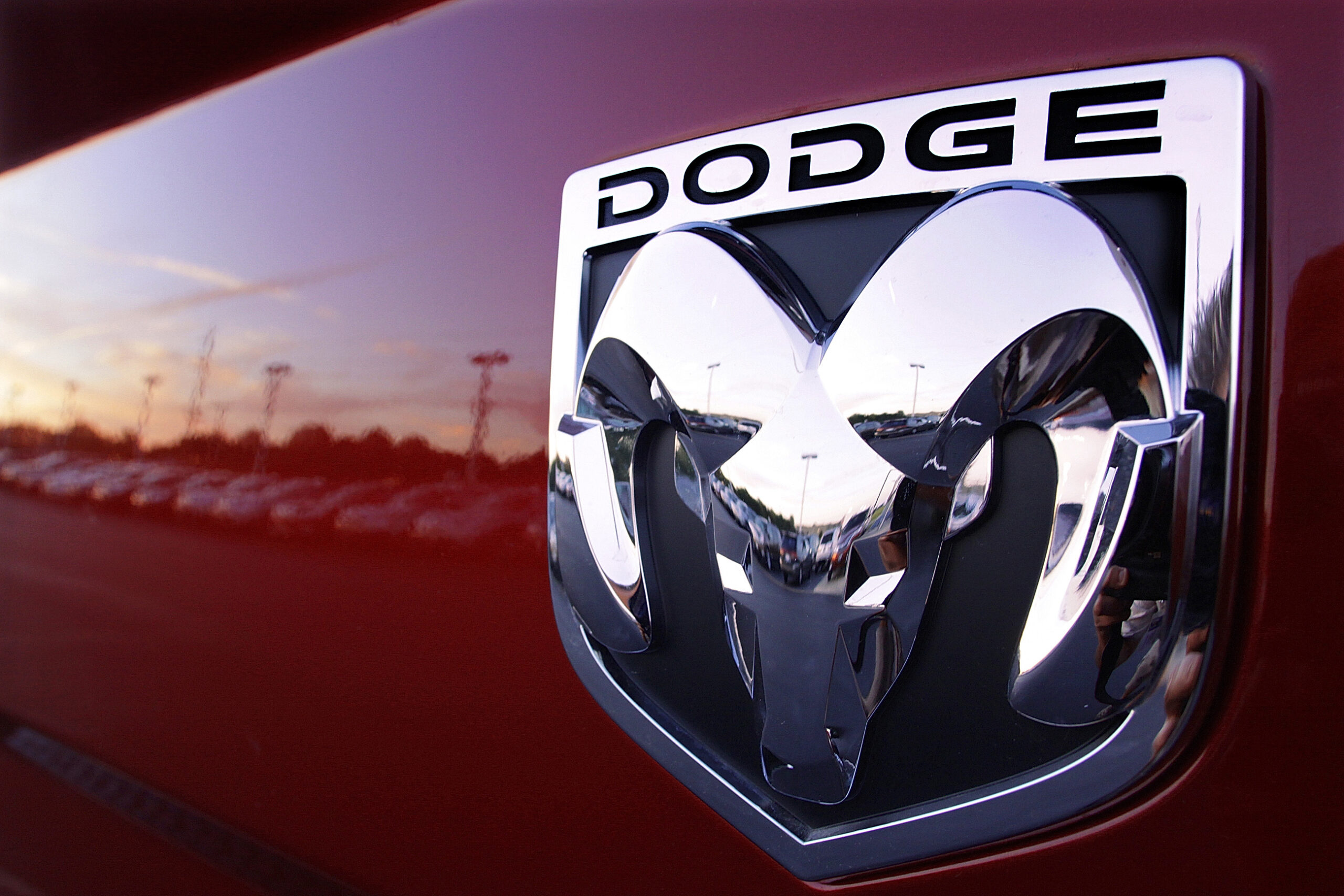 FILE- The Dodge logo is seen on a new Dodge RAM 3500 Heavy Duty pickup trucks at sunset at a dealer...