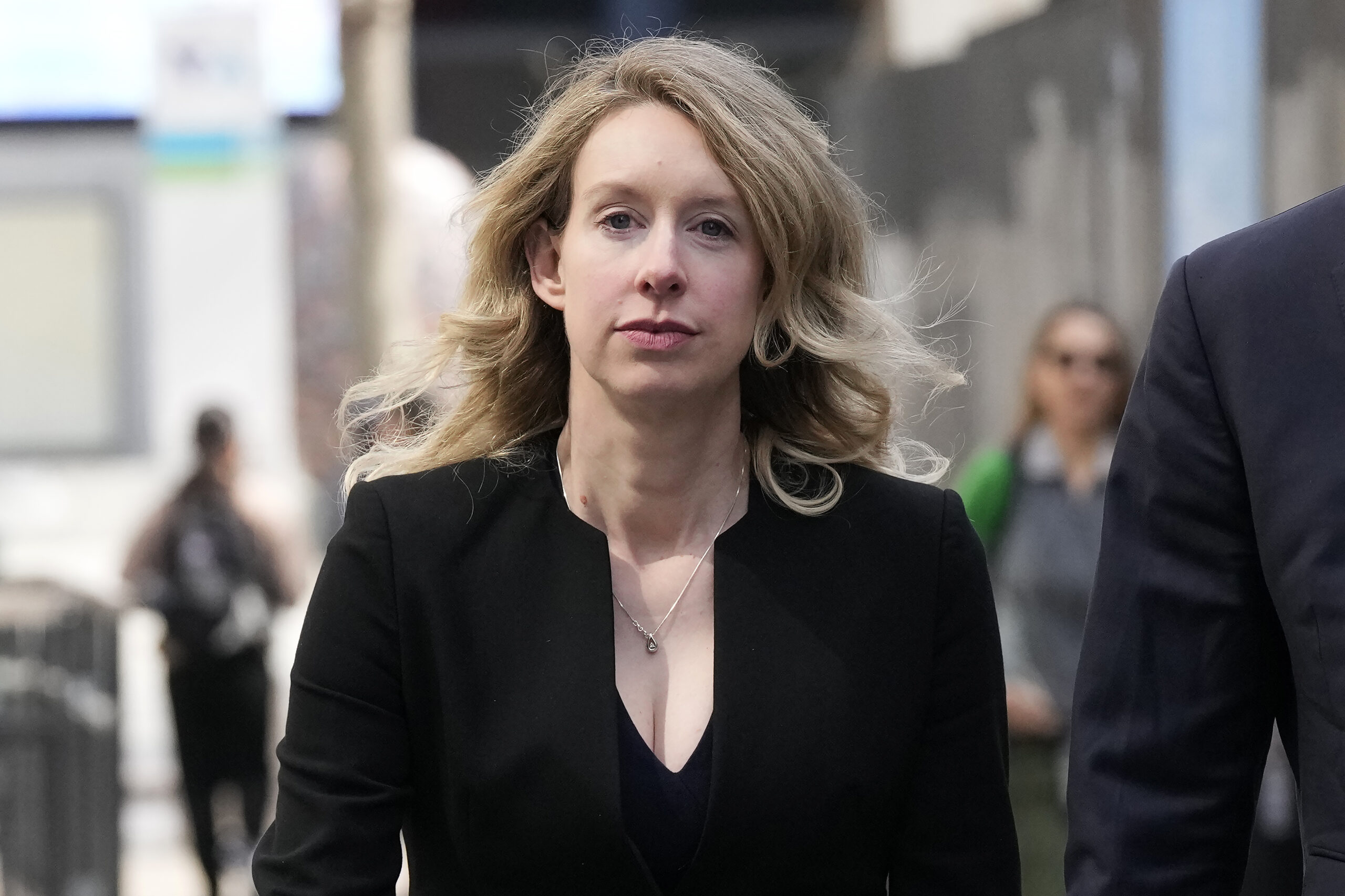 FILE - Former Theranos CEO Elizabeth Holmes leaves federal court in San Jose, Calif., March 17, 202...