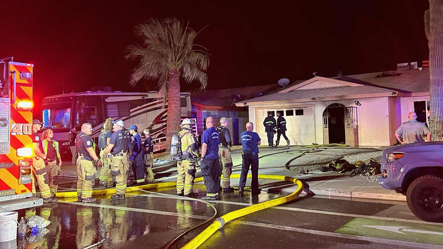 Two people were hospitalized in extremely critical condition after being pulled from a house fire i...