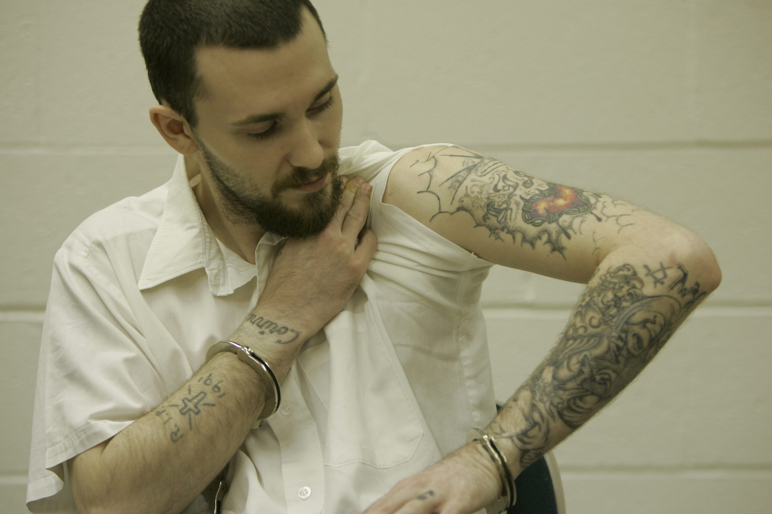 FILE - Inmate Michael Tisius, sentenced to death in the killing of two jail officers, shows his tat...