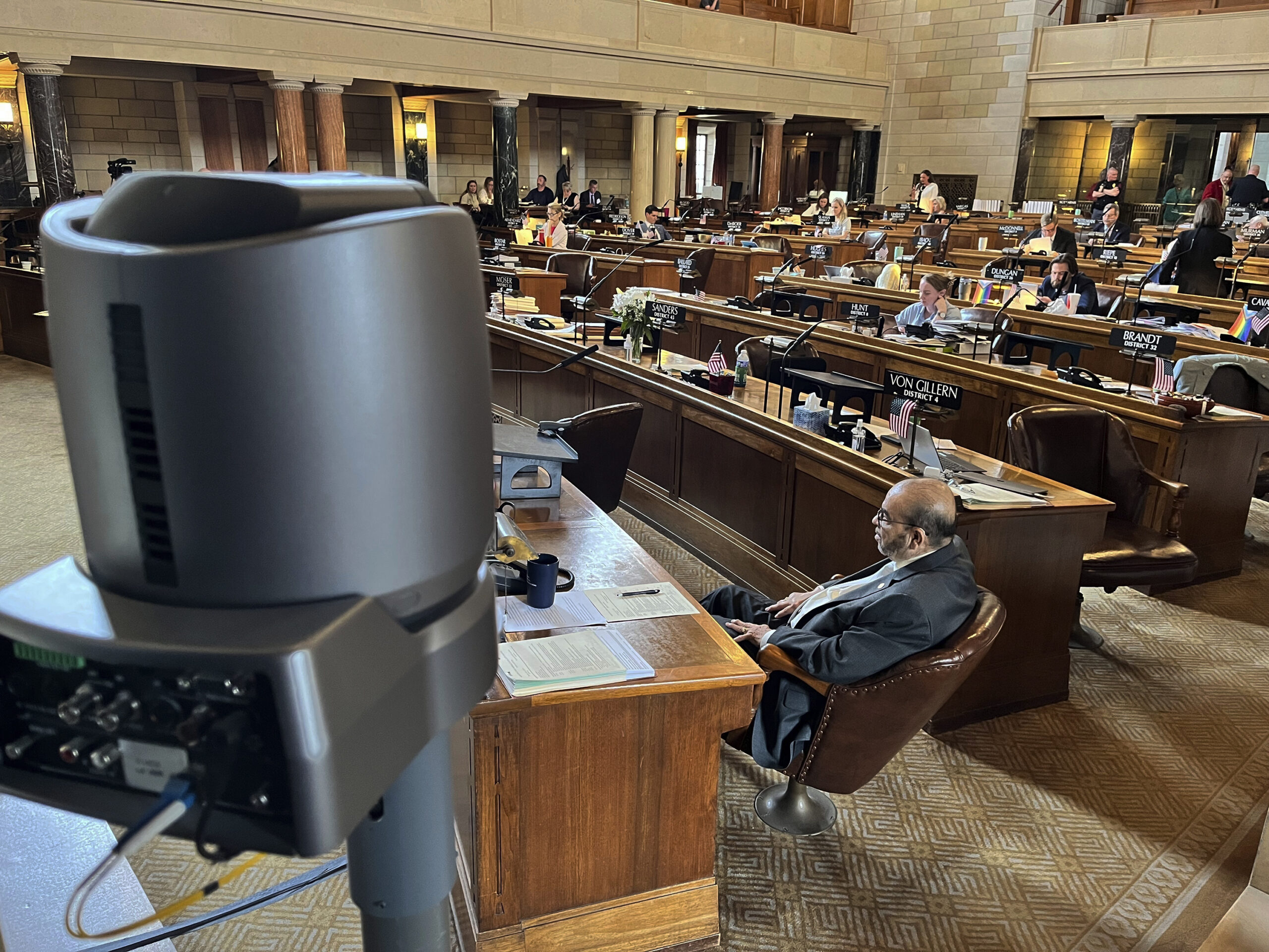 One of several cameras set up to capture live debate in the chamber of the Nebraska Legislature is ...