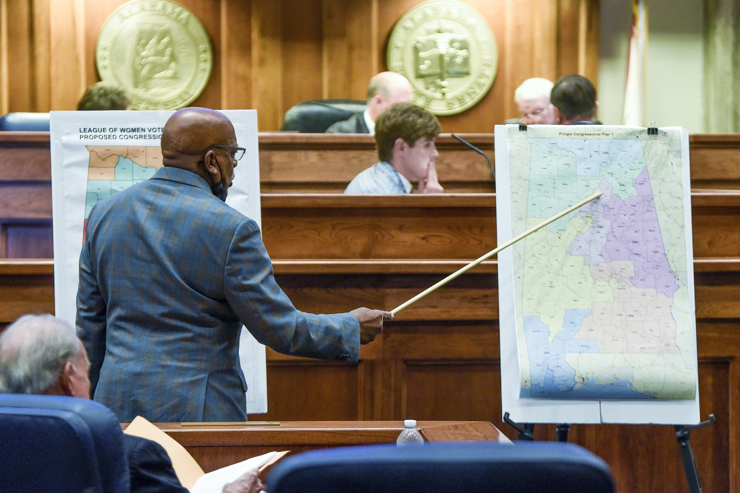 FILE - Sen. Rodger Smitherman compares U.S. Representative district maps during the special session...