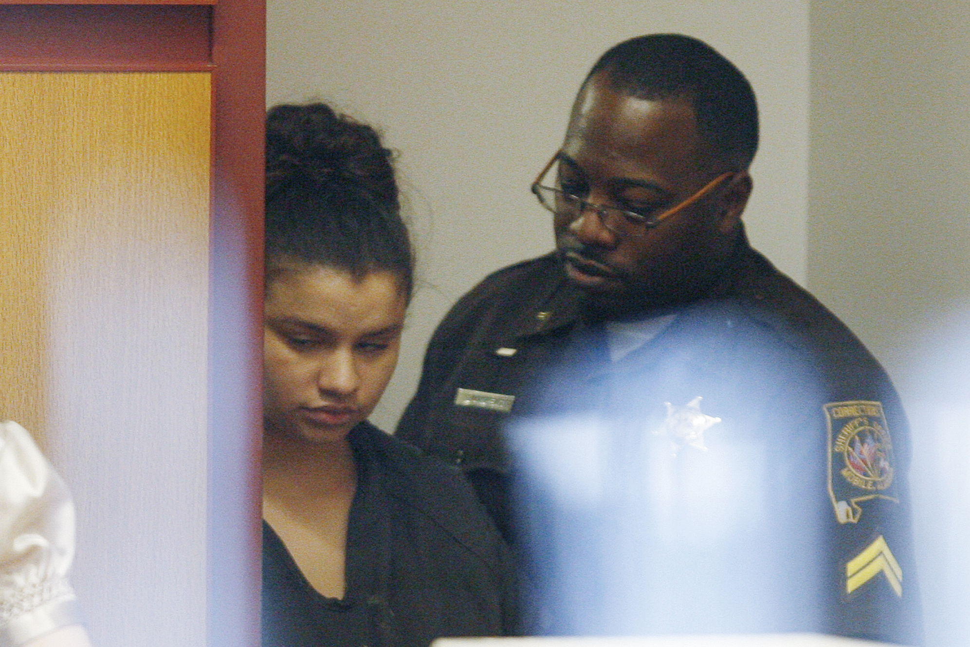 FILE - Heather Leavell-Keaton, 22, left, is led into the courtroom by a sheriff's deputy as she app...