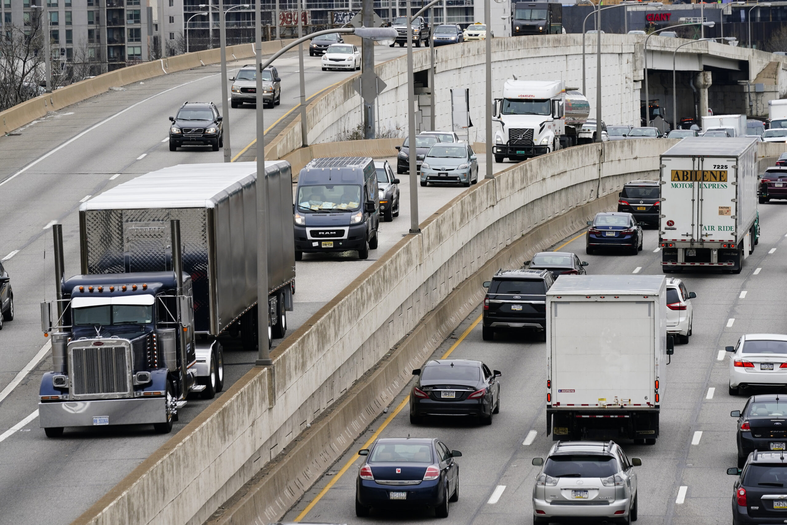 FILE - Motor vehicle traffic moves along the Interstate 76 highway in Philadelphia, March 31, 2021....