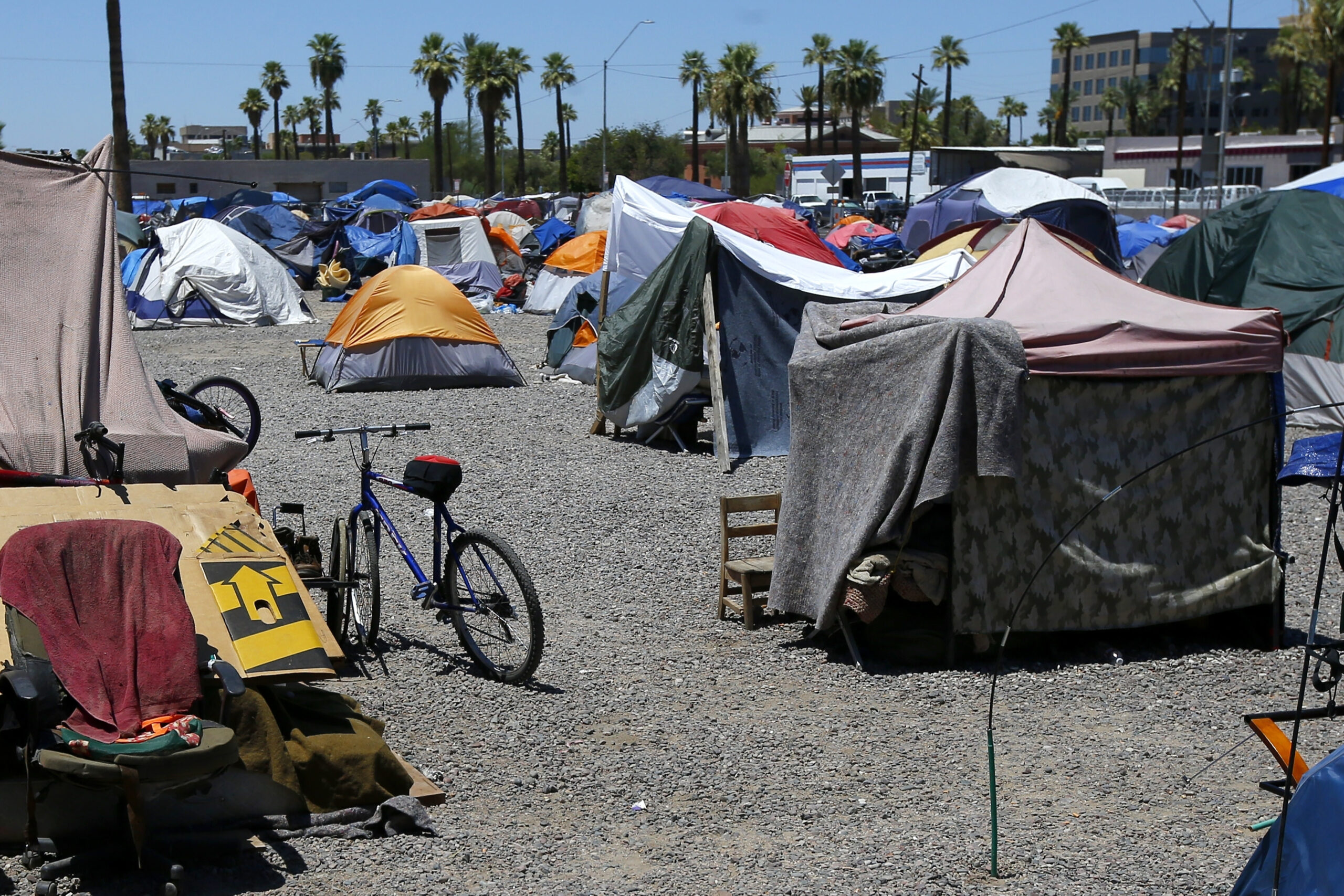 FILE - A large homeless encampment is shown in Phoenix, on Aug. 5, 2020. The city of Phoenix is sch...