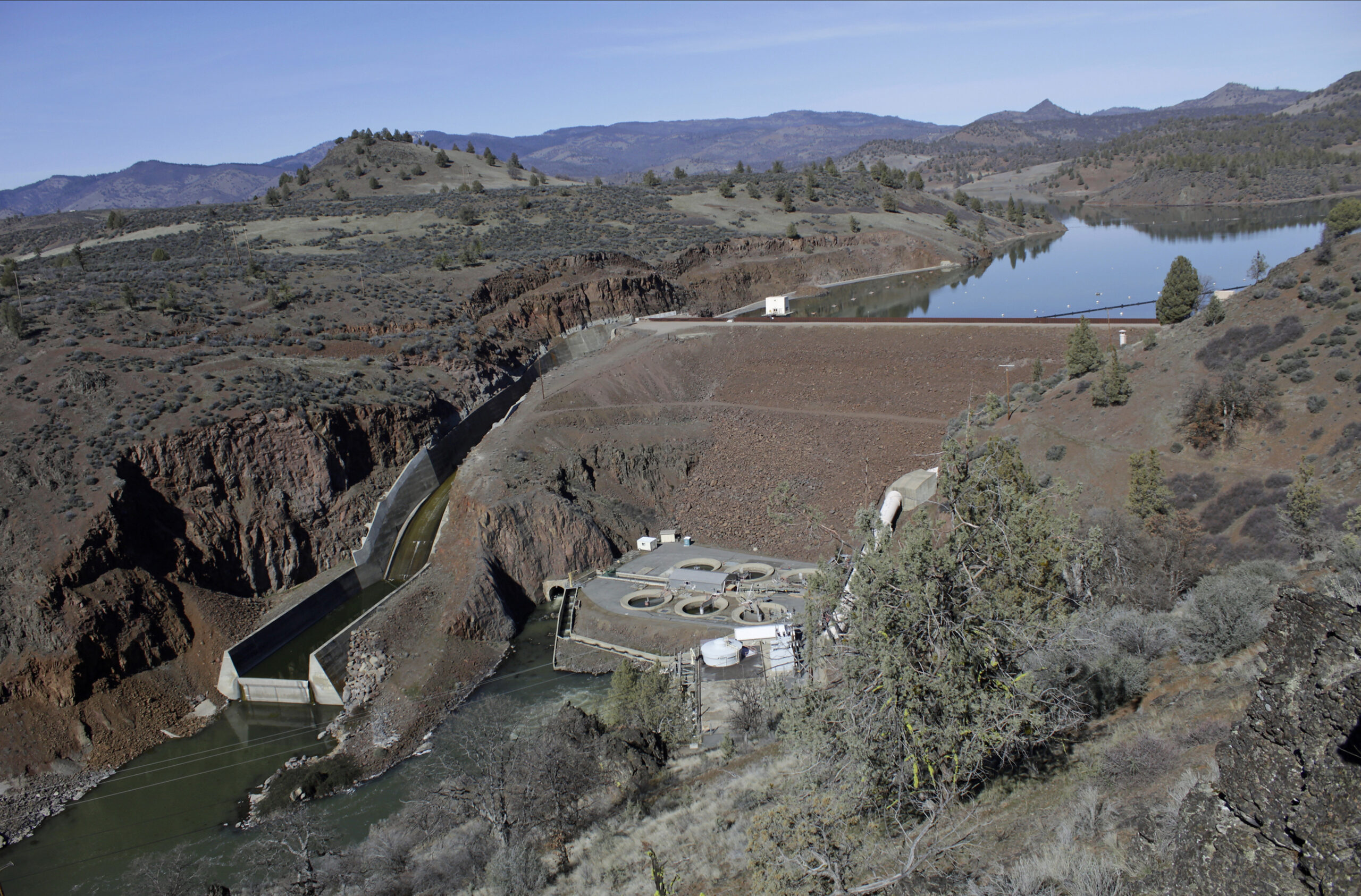 FILE - The Iron Gate Dam powerhouse and spillway are seen on the lower Klamath River near Hornbrook...