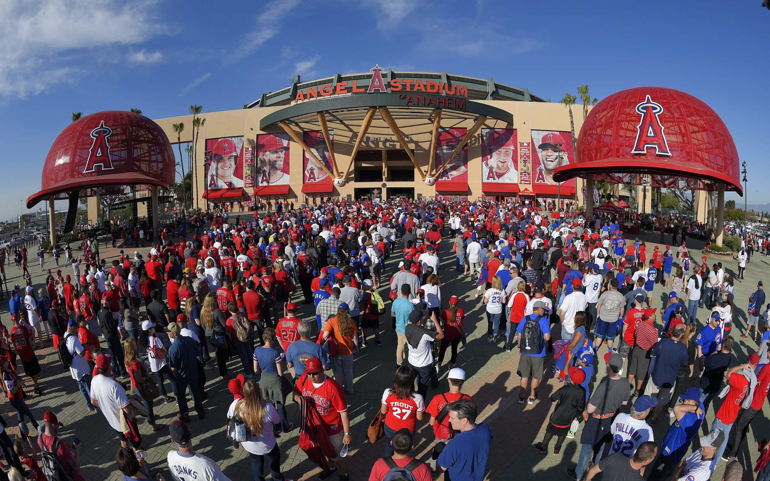FILE - Fans line up outside Angel Stadium of Anaheim for an opening day baseball game between the L...