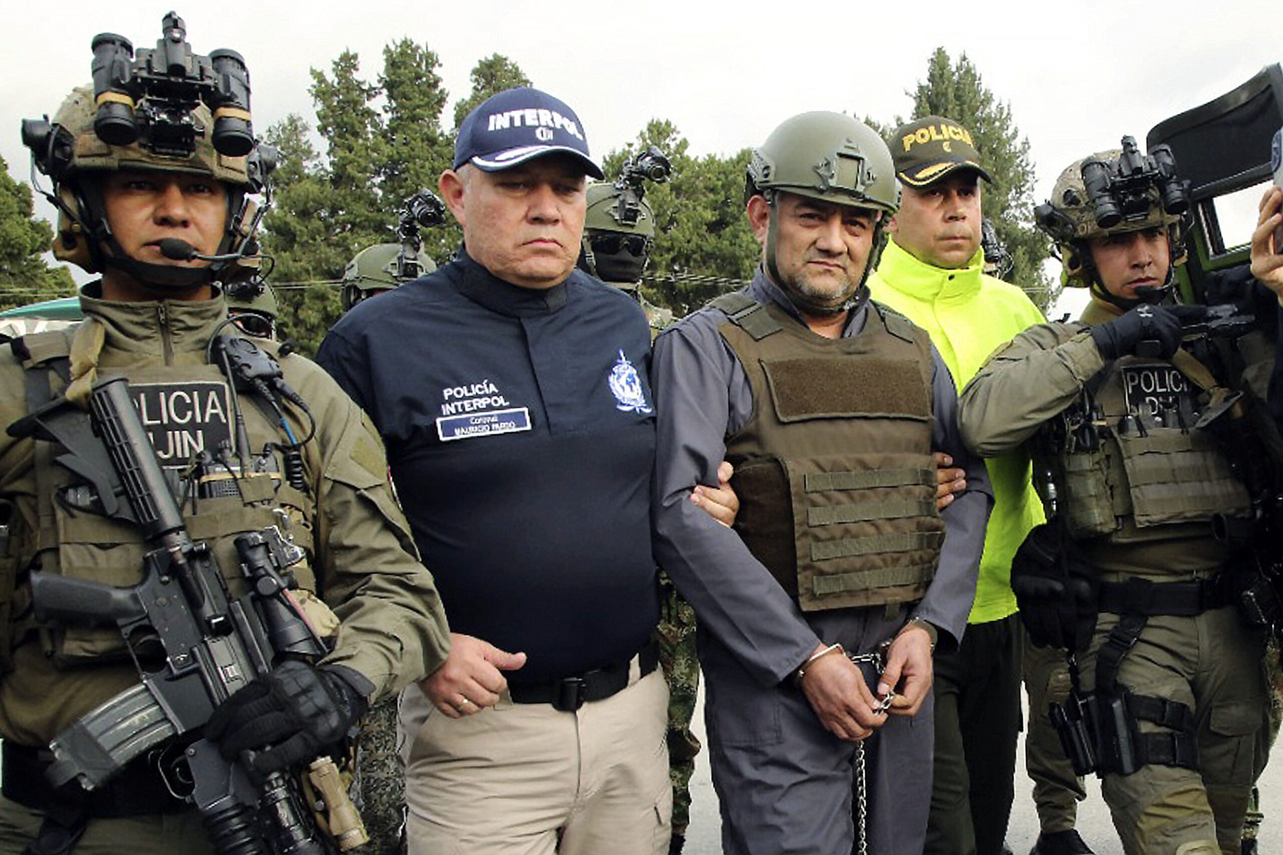 FILE — In this photo released by the Colombian Presidential Press Office, May 4, 2022, police esc...
