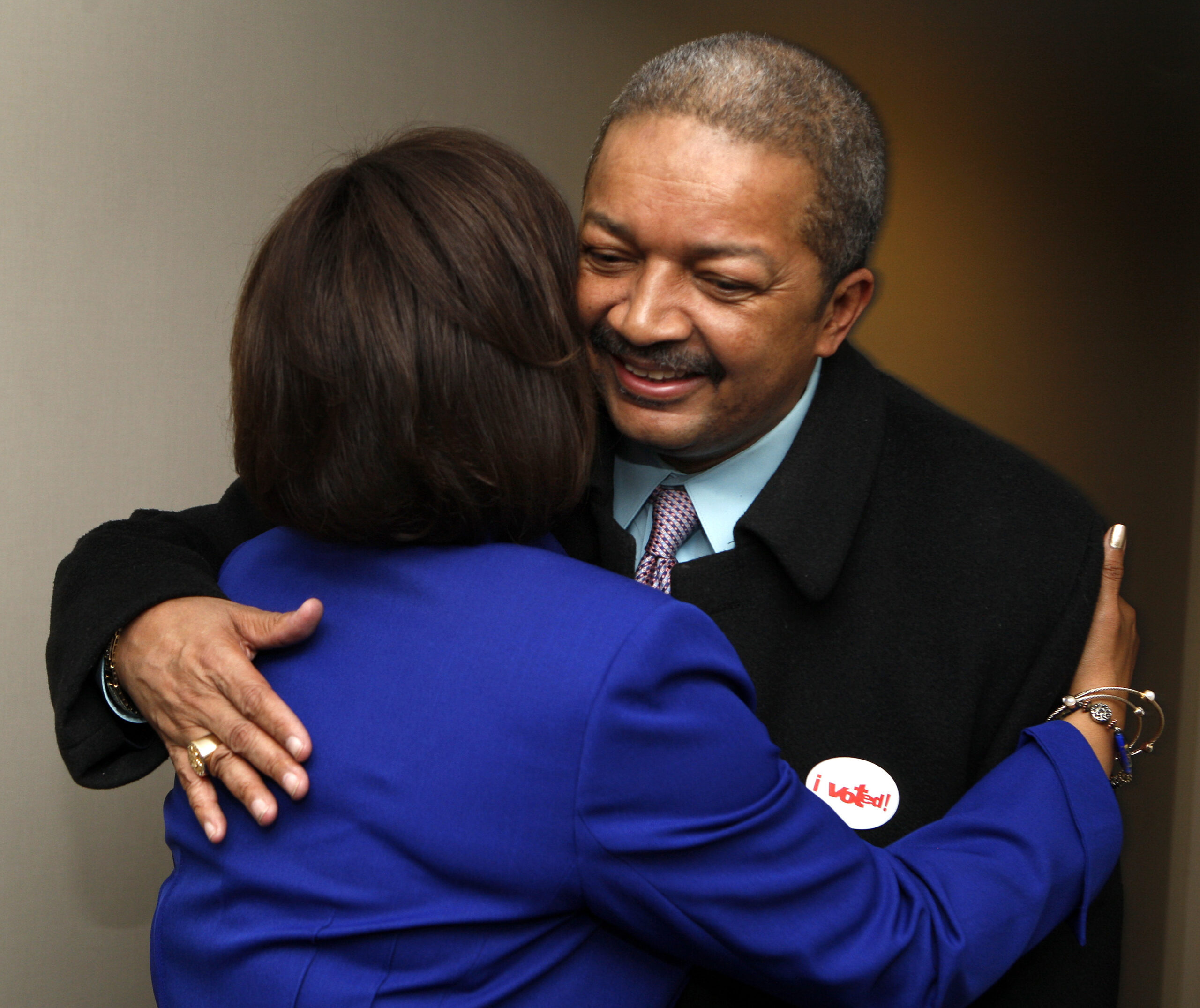FILE - Democrat Robin Kelly, left, greets her husband, Dr. Nathaniel Horn, in her suite as she awai...