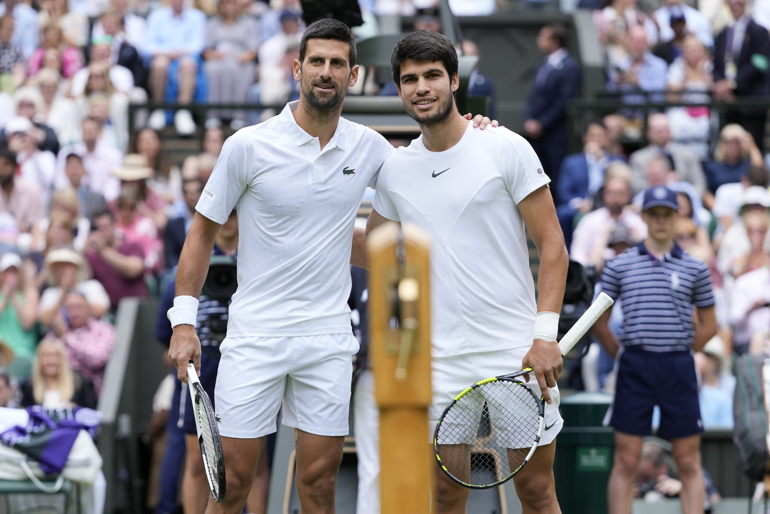 FILE - Serbia's Novak Djokovic, left, and Spain's Carlos Alcaraz pose for a photo ahead of the fina...