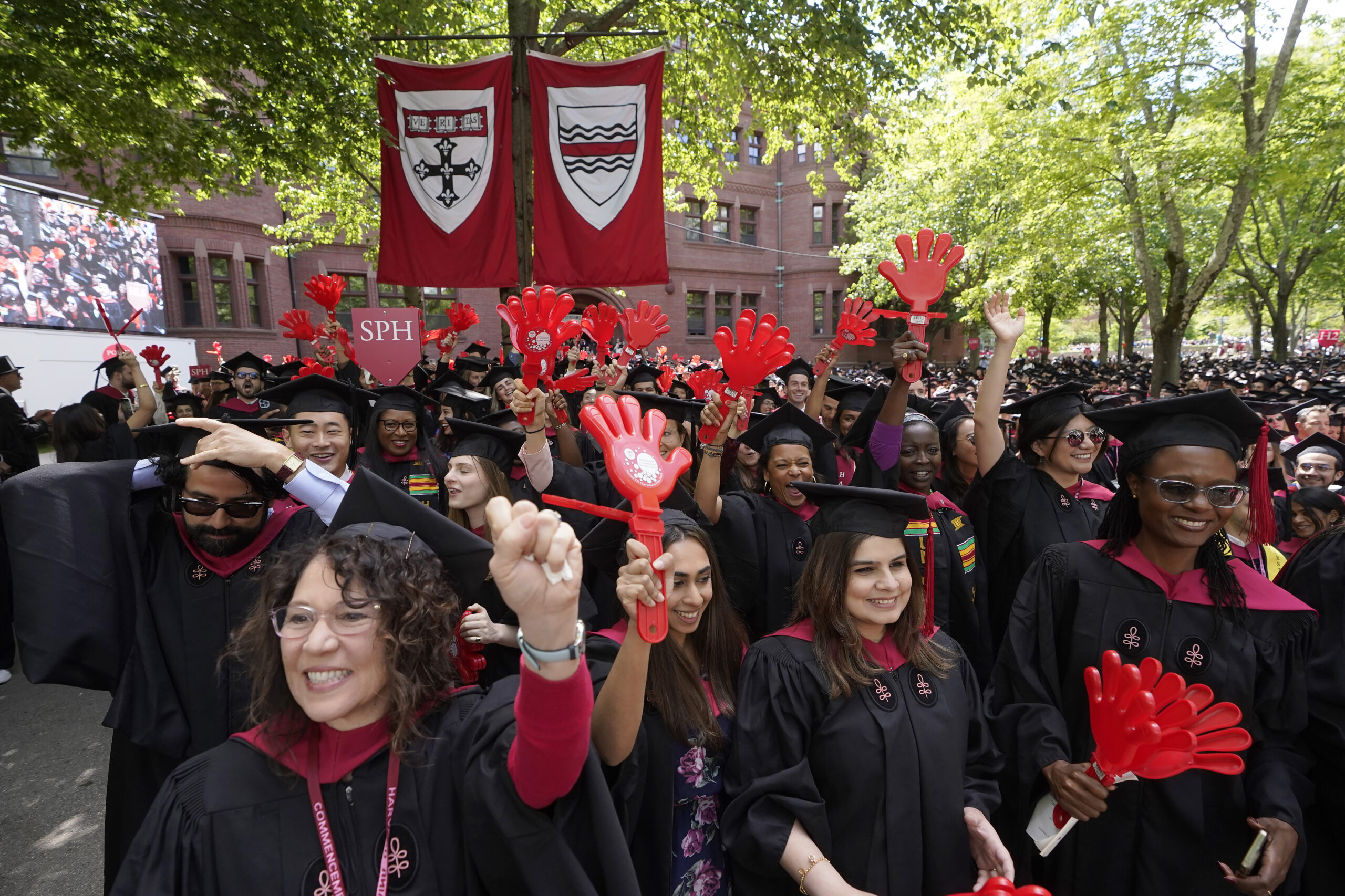 File - Graduating Harvard University students celebrate their degrees during commencement ceremonie...