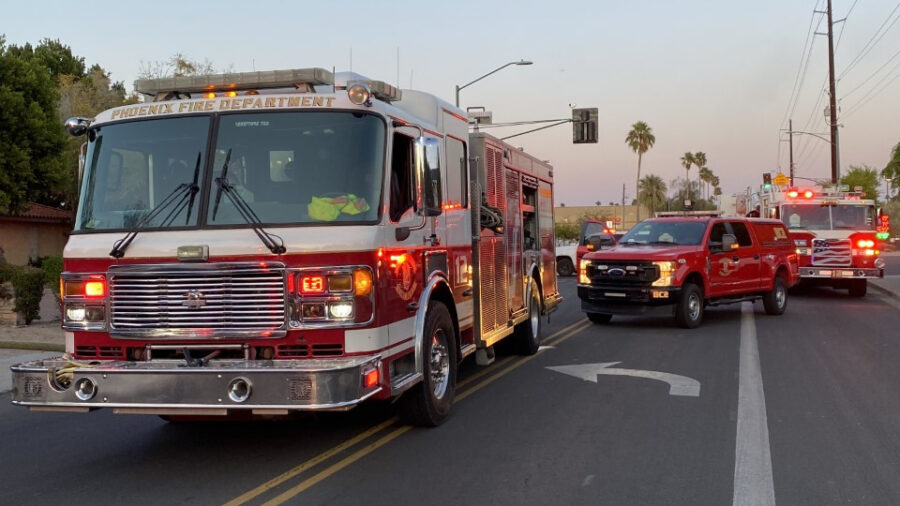 This file photo shows fire trucks lining the street in Phoenix, Arizona. A woman was killed in a tw...
