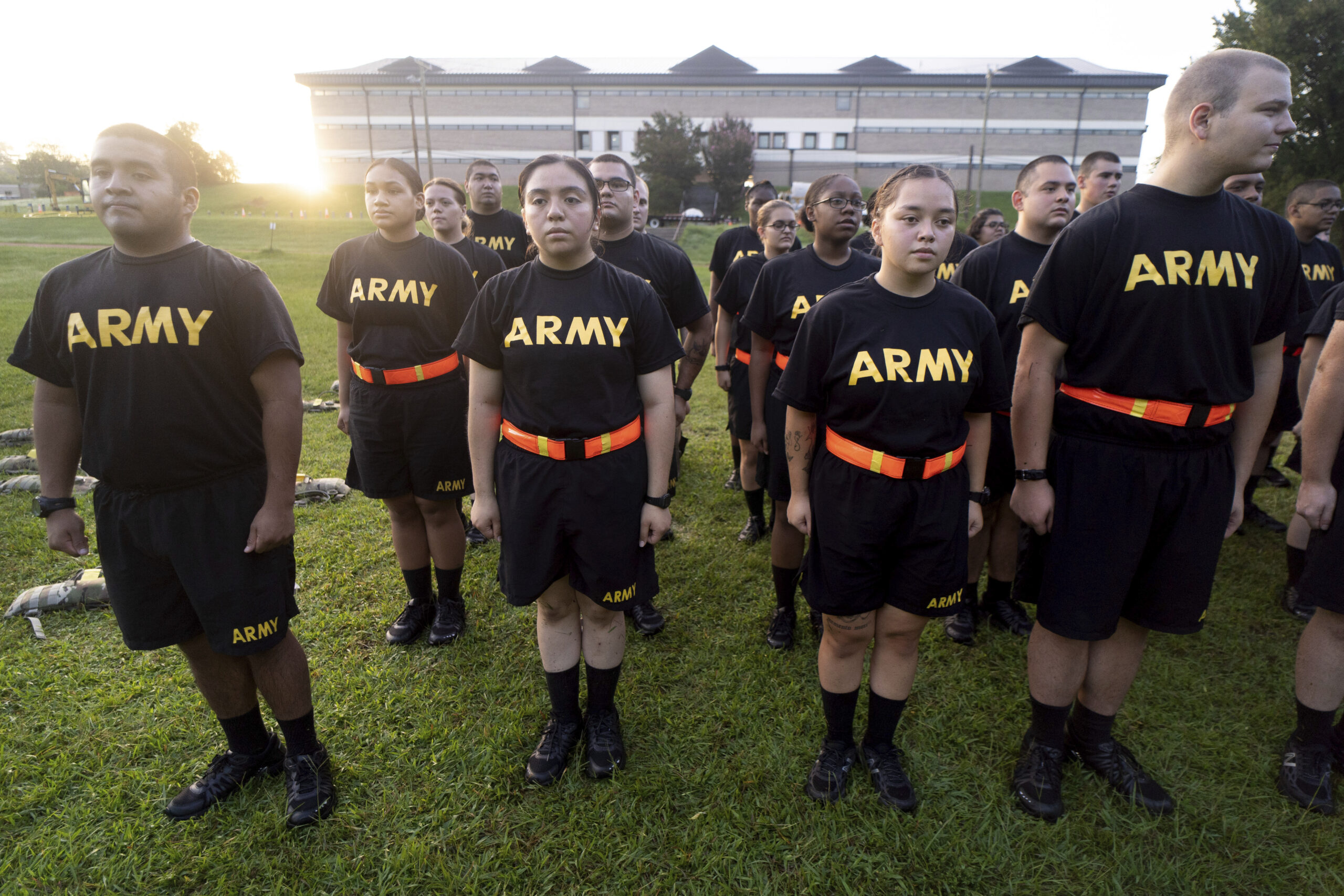 FILE - Students in the new Army prep course stand at attention after physical training exercises at...