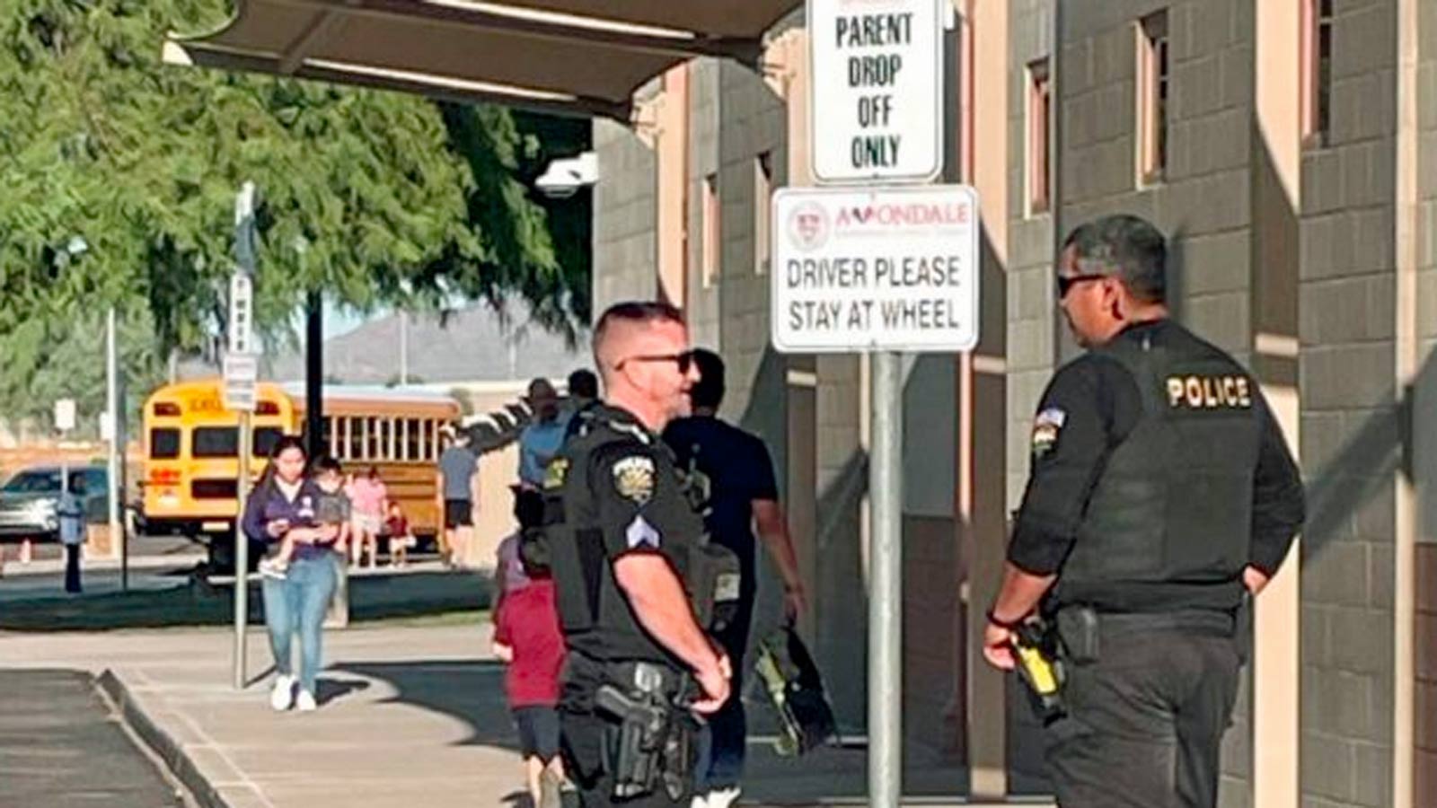 File photo of police officers at a metro Phoenix campus. Staffing shortages have made filling schoo...