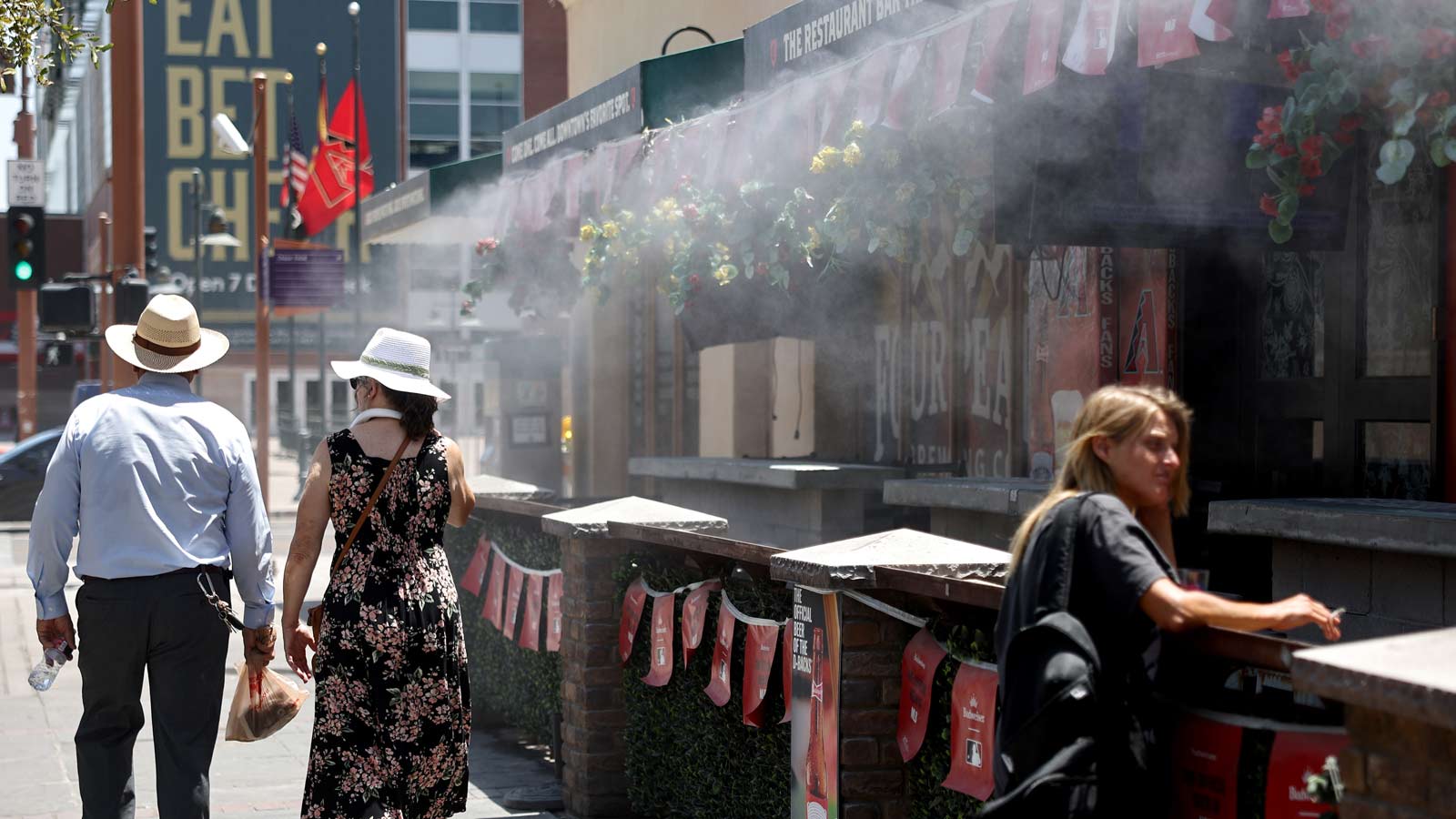 Misters cool things off outside a downtown Phoenix restaurant on July 25, 2023. After a brief respi...