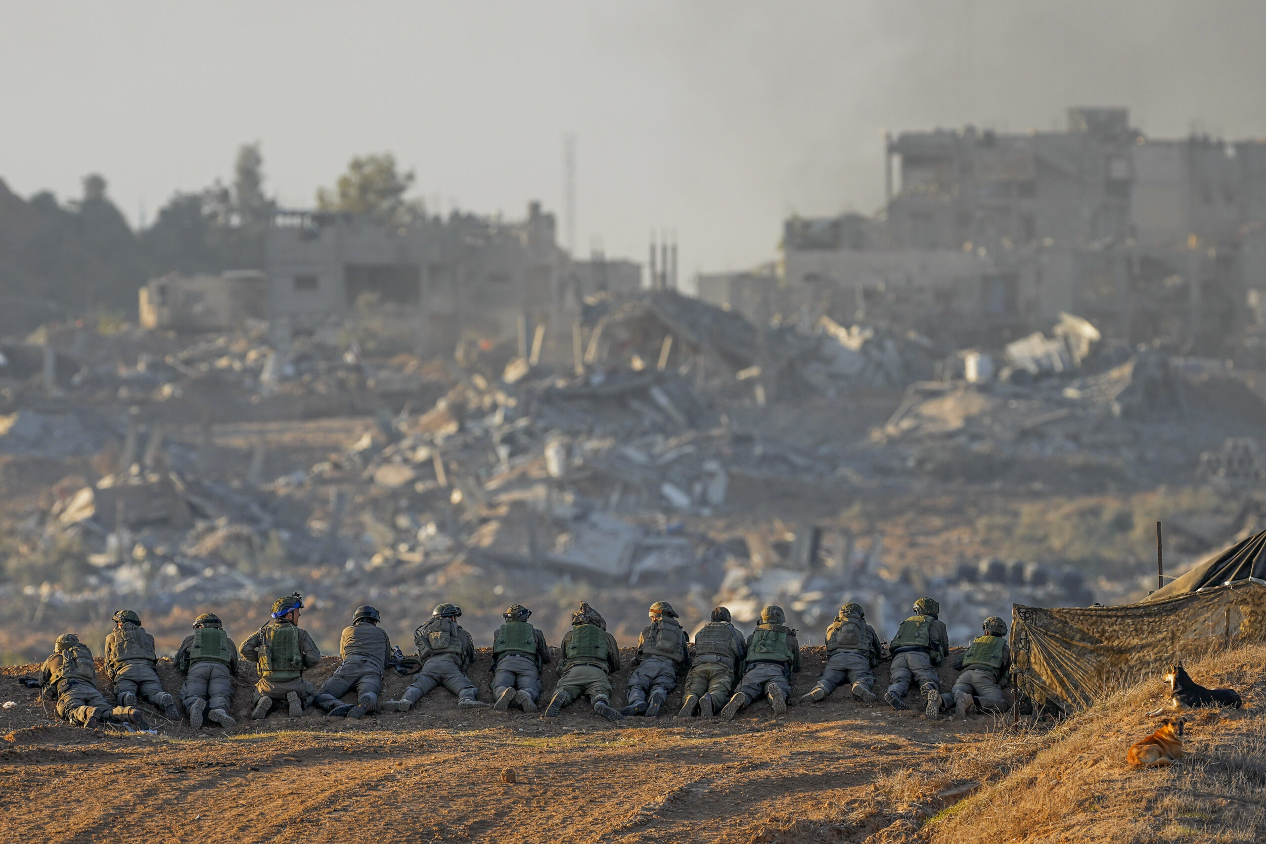 Israeli soldiers take positions near the Gaza Strip border, in southern Israel, Monday, Dec. 11, 20...