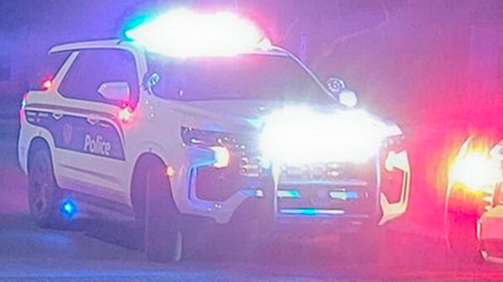 File photo of Phoenix Police cruiser with lights on at night...