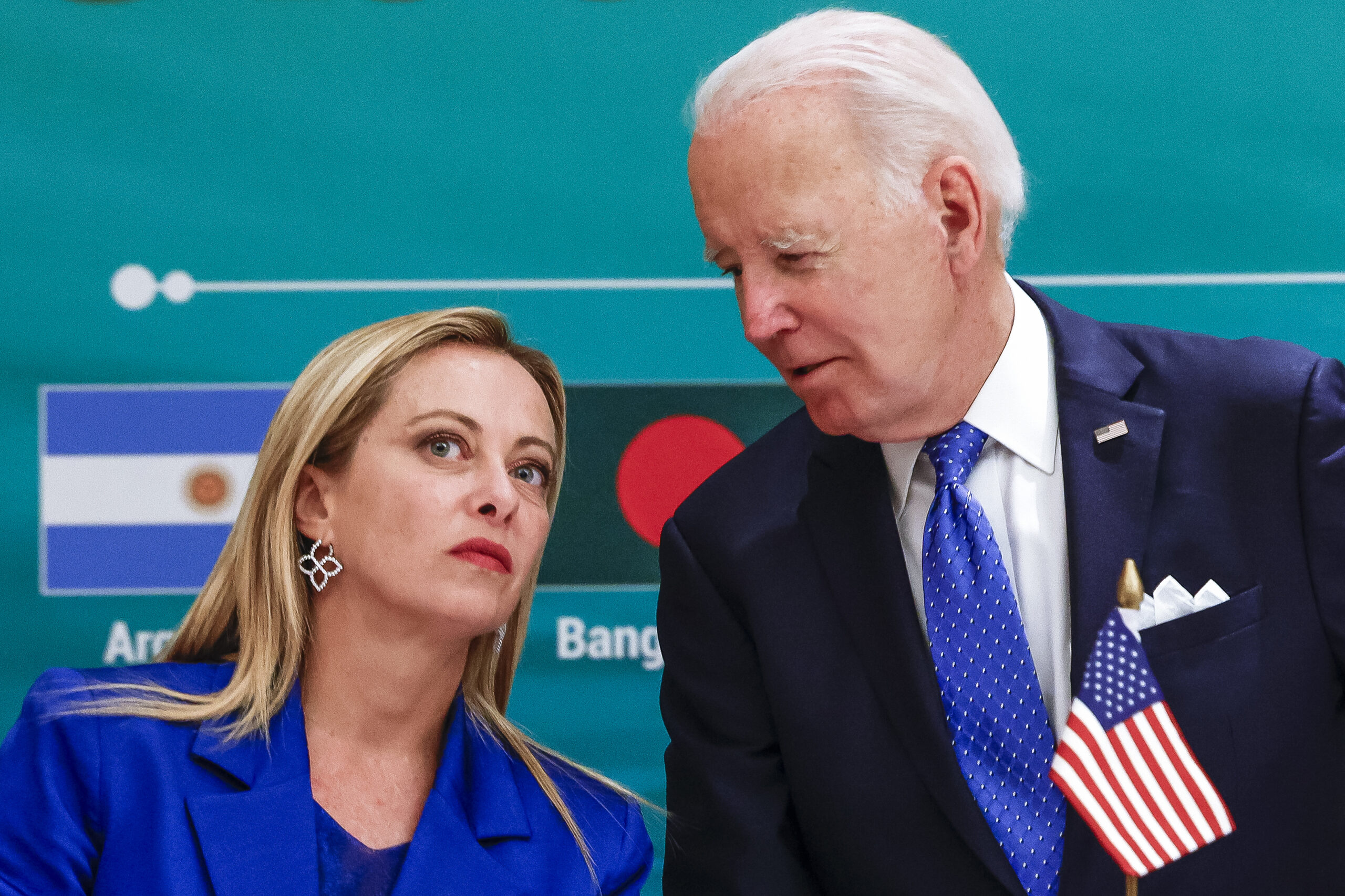 FILE - Italian Prime Minister Giorgia Meloni and President Joe Biden talk during the launch of the ...