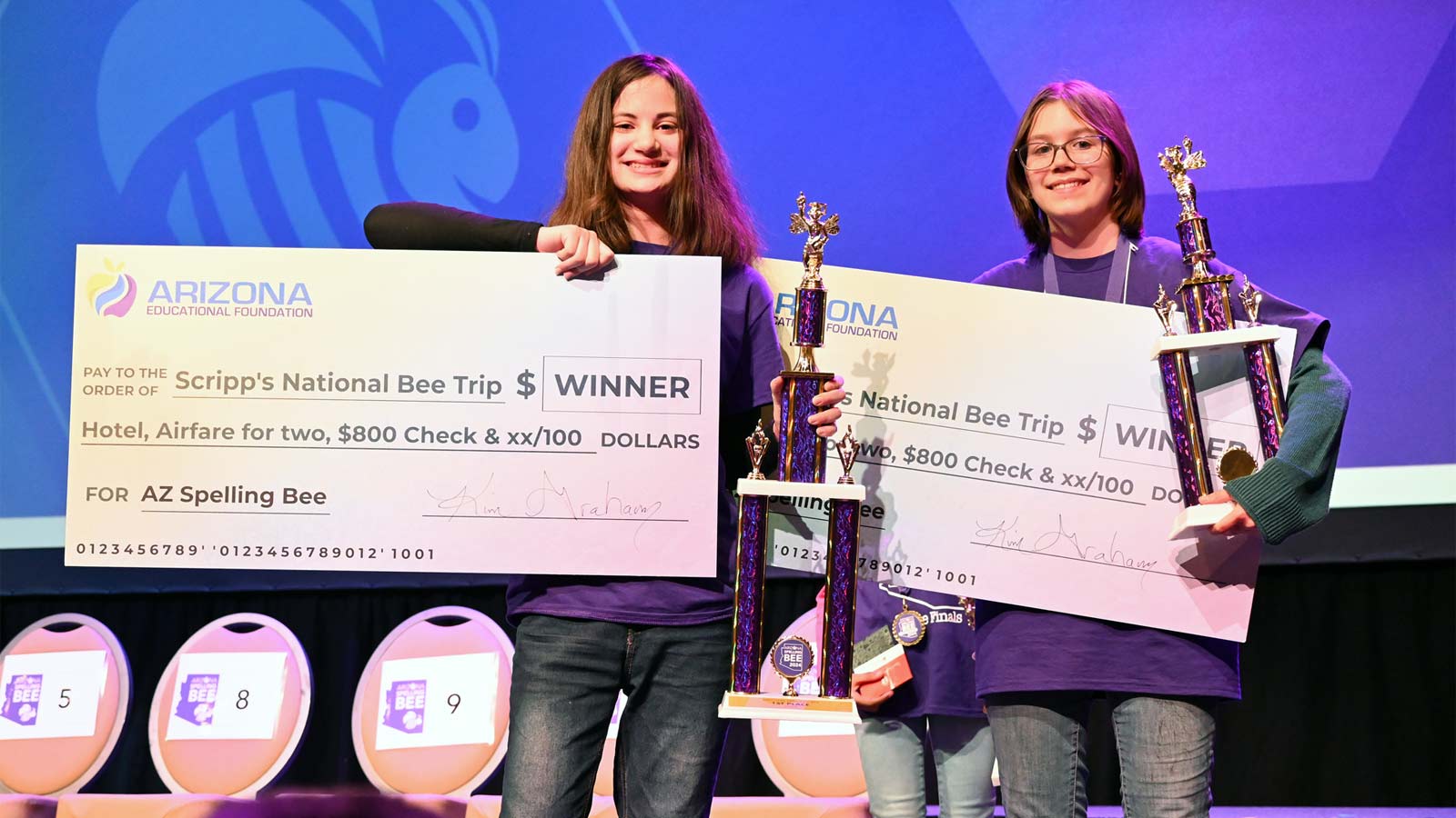 Aliyah Alpert, left, and Isabelle Garcia pose with prizes and trophies after taking the top two spo...