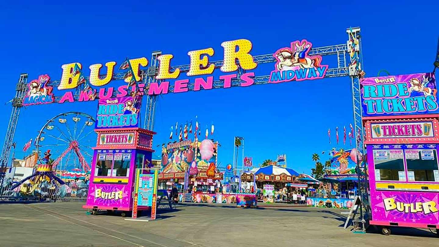 A file photo shows a Butler Amusements midway with ticket booths, rides and games....