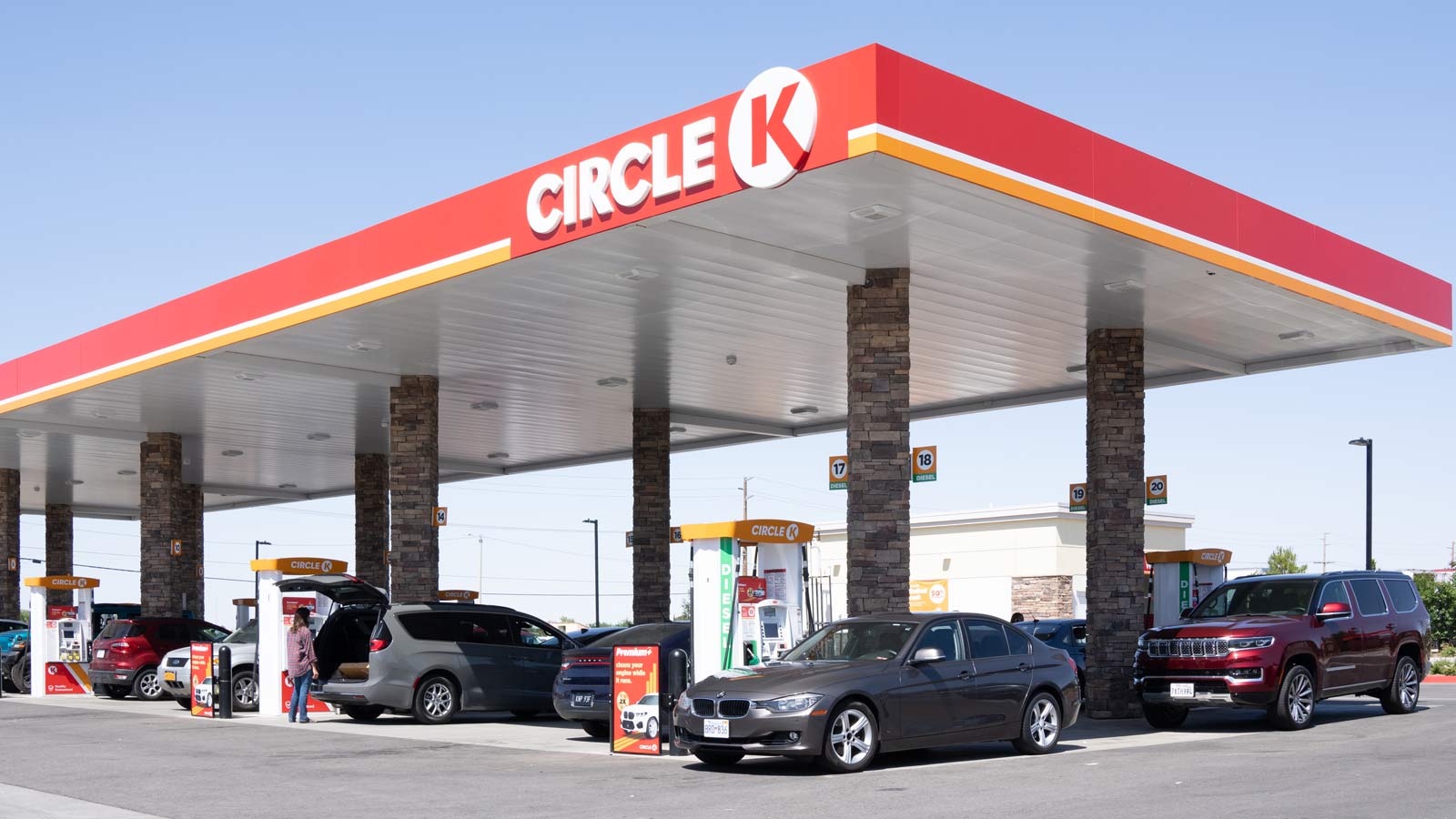 Cars are parked at the pumps at a Circle K gas station....