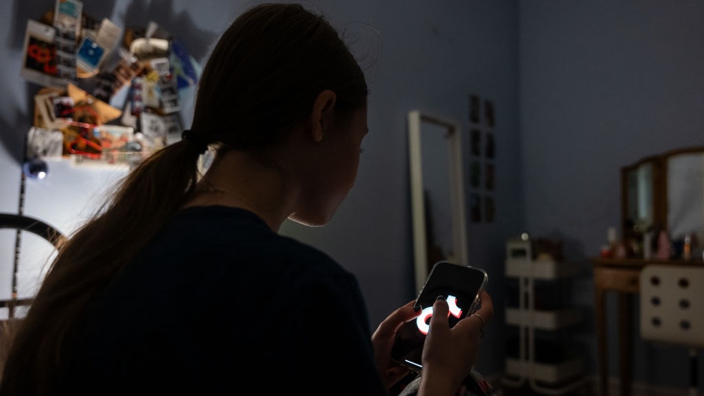 NEW YORK, NEW YORK - JANUARY 31: In this photo illustration, a teenager uses her mobile phone to ac...