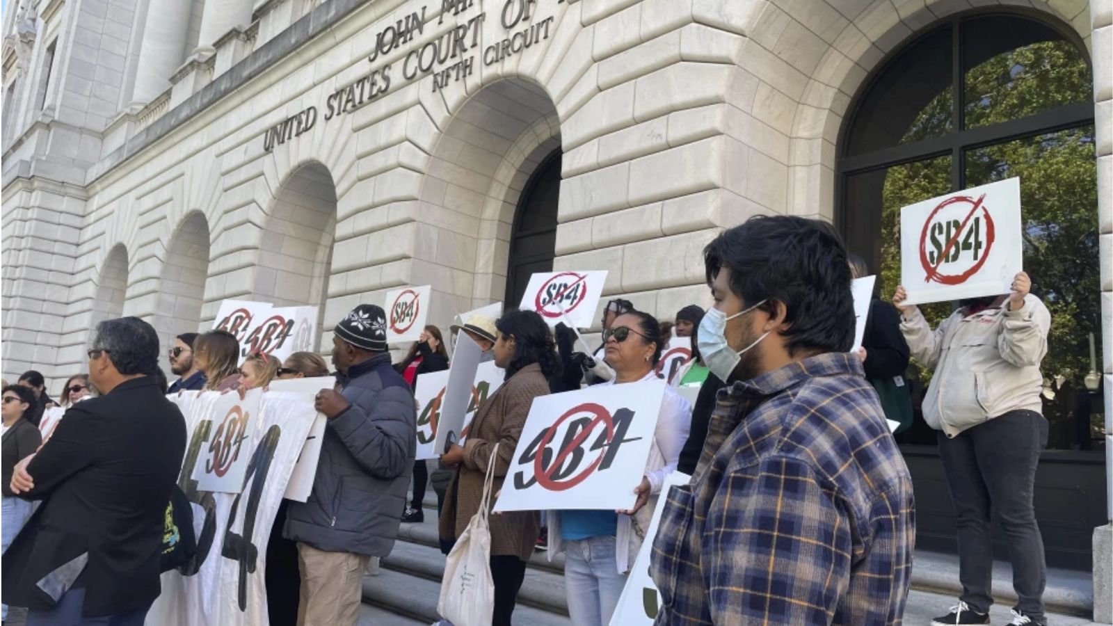 Demonstrators gather outside federal court buildings in New Orleans on Wednesday, April 3, 2024, to...