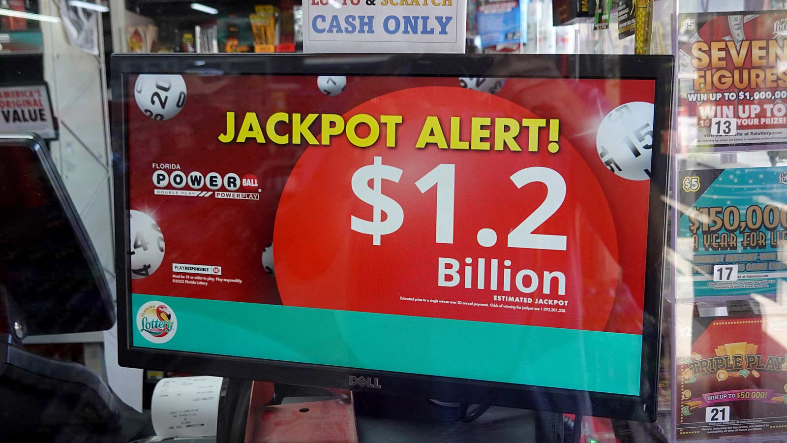 A sign at a Florida convenience story shows an estimated $1.2 billion jackpot before an October 202...
