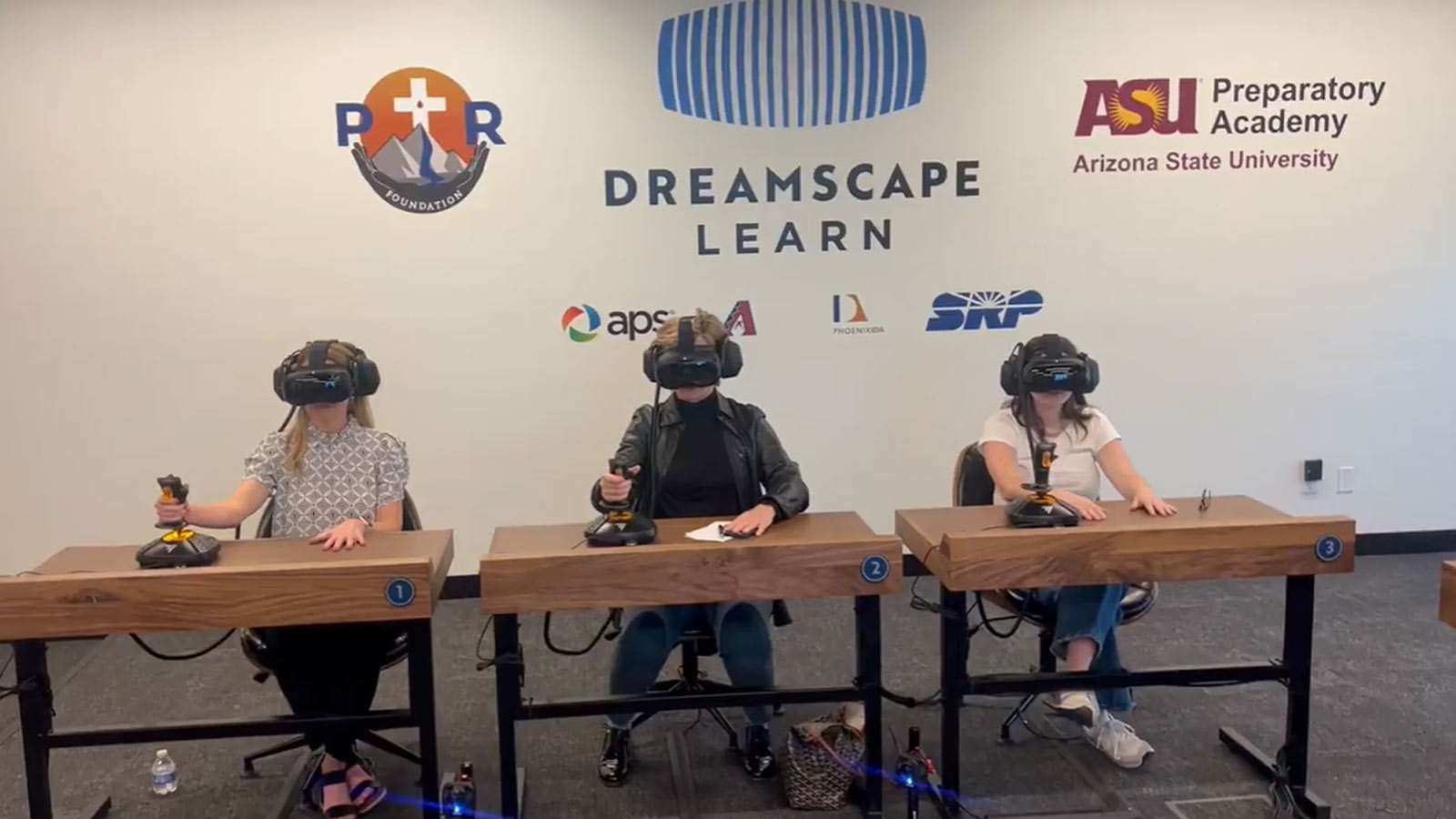 Students wear virtual reality headsets in the Dreamscape Learn pod at ASU Prep Pilgrim Rest Element...