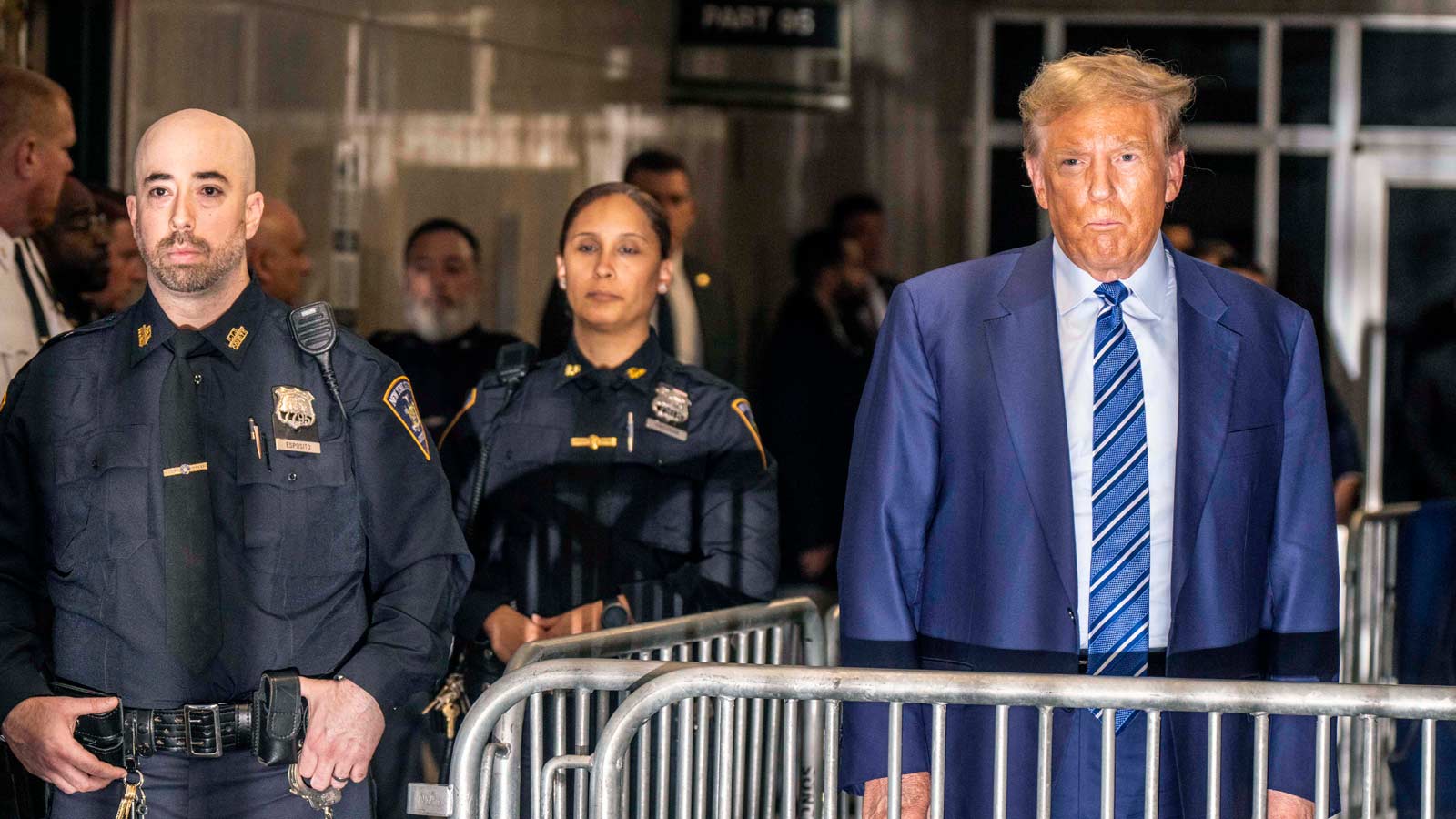 Donald Trump talks to reporters as he leaves court on the second day of his criminal trial on April 16, 2024, in New York City.