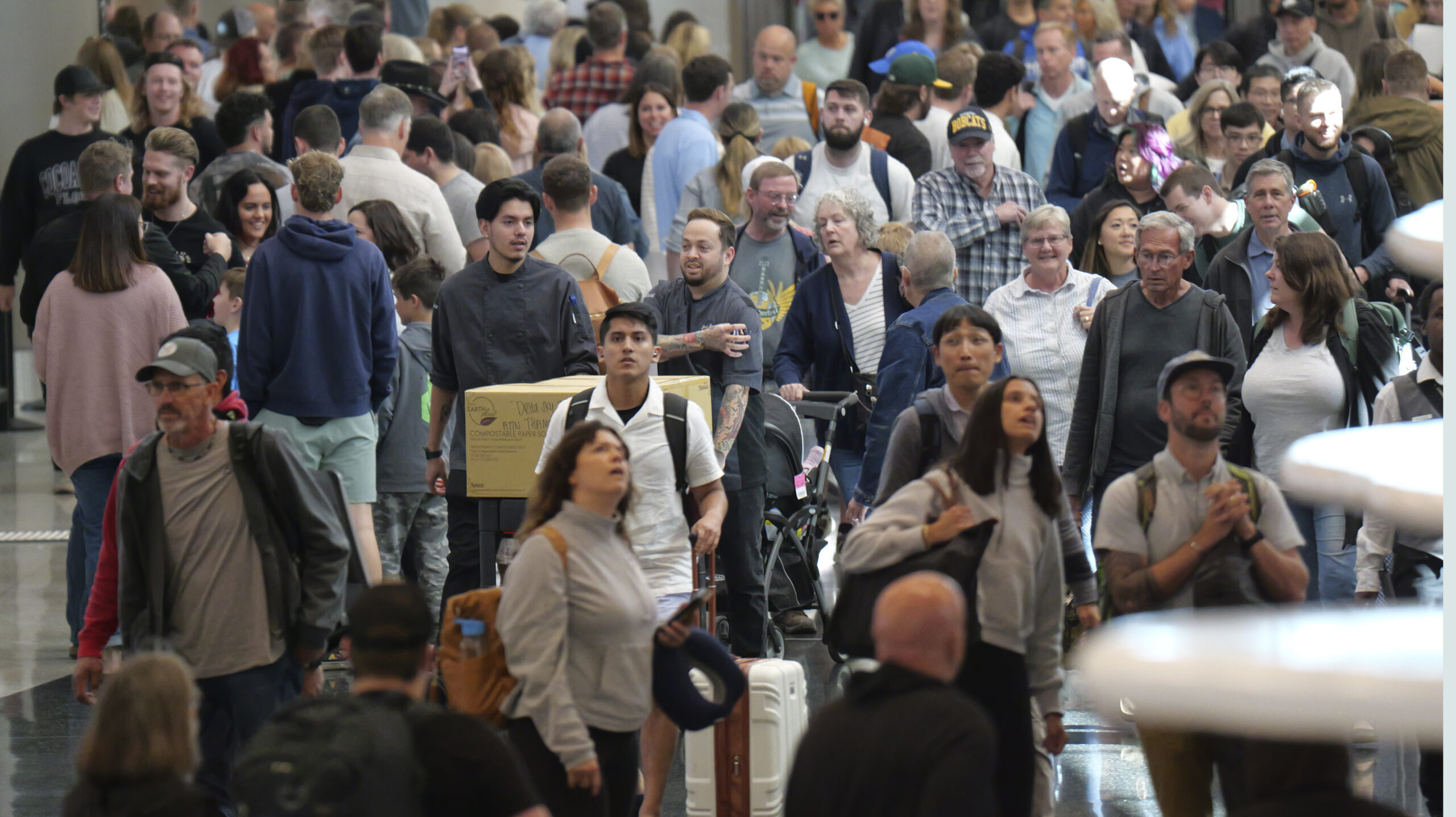 Travelers walk through Salt Lake City International Airport Friday, May 24, 2024, in Salt Lake City...