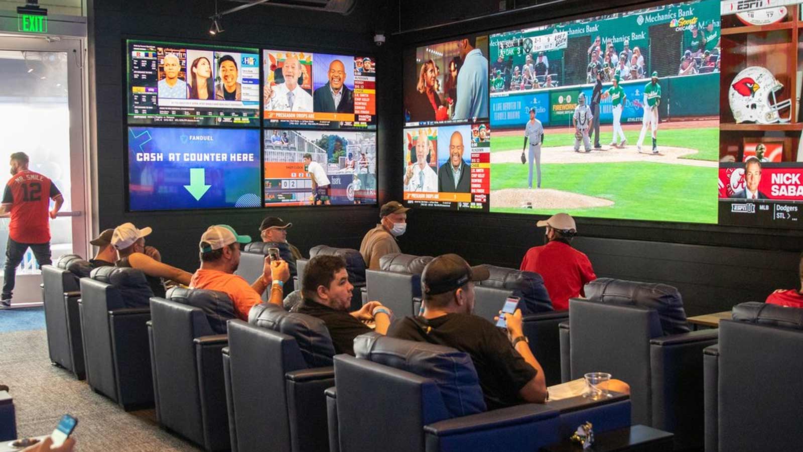 Bettors watch games at the FanDuel Sportsbook at Footprint Center in Phoenix....