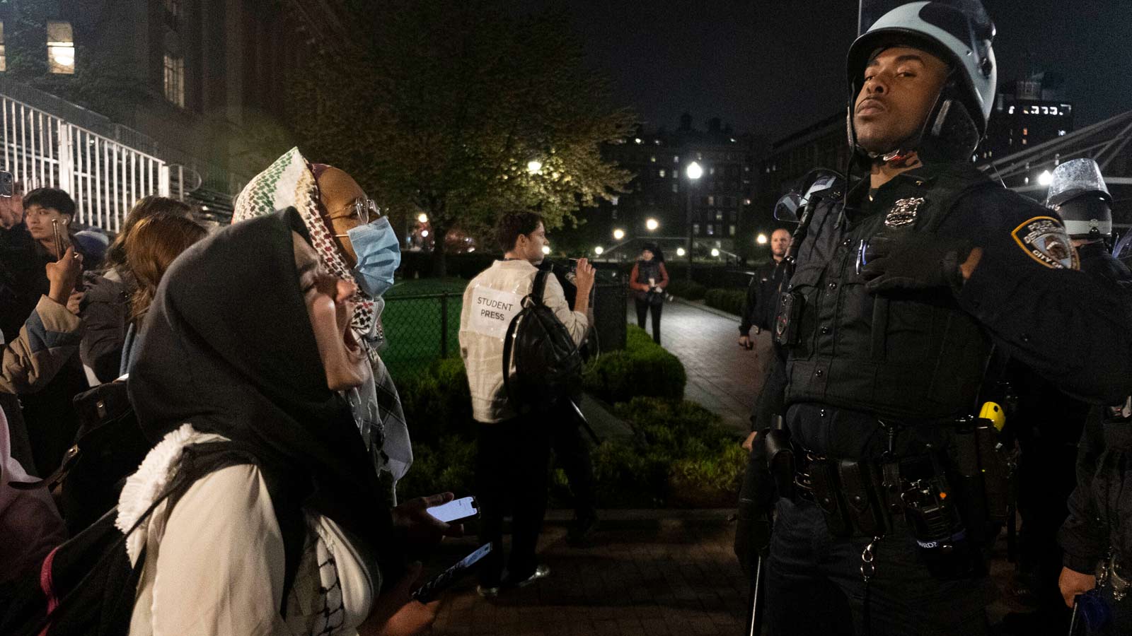 Pro-Palestine activists face off with New York Police Department officers during a raid on Columbia...