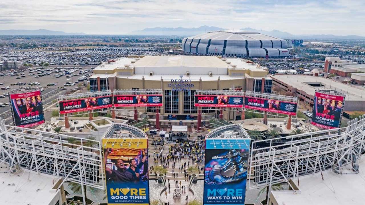 Aerial view of Desert Diamond Arena in Glendale and the surrounding area, with State Farm Stadium i...