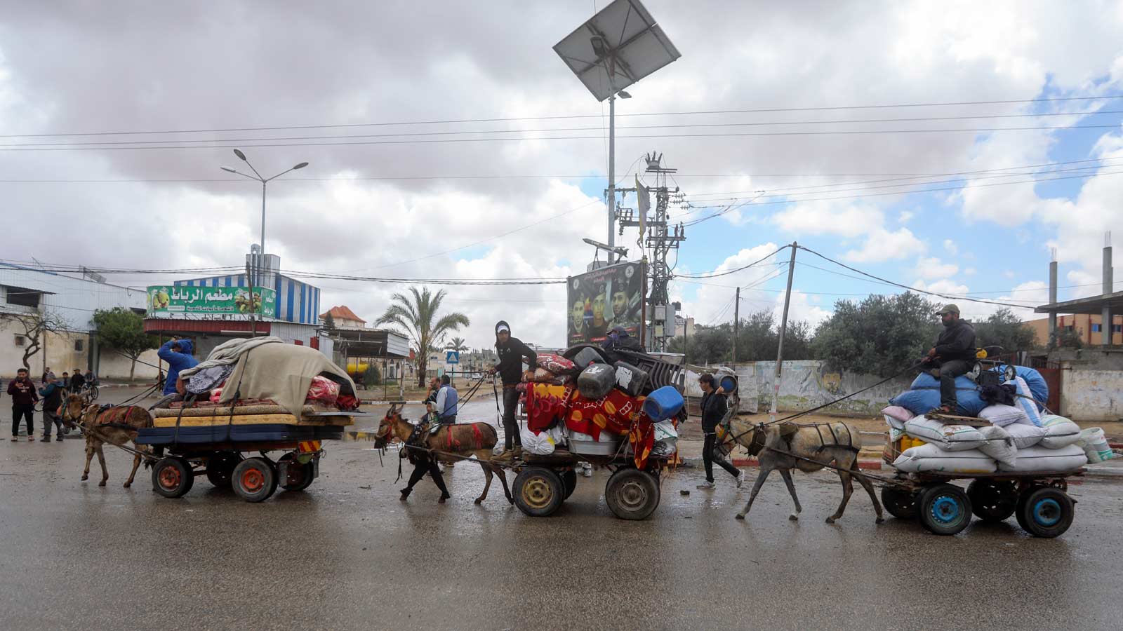 Palestinians flee from the eastern side of the southern Gaza city of Rafah after the Israeli army o...