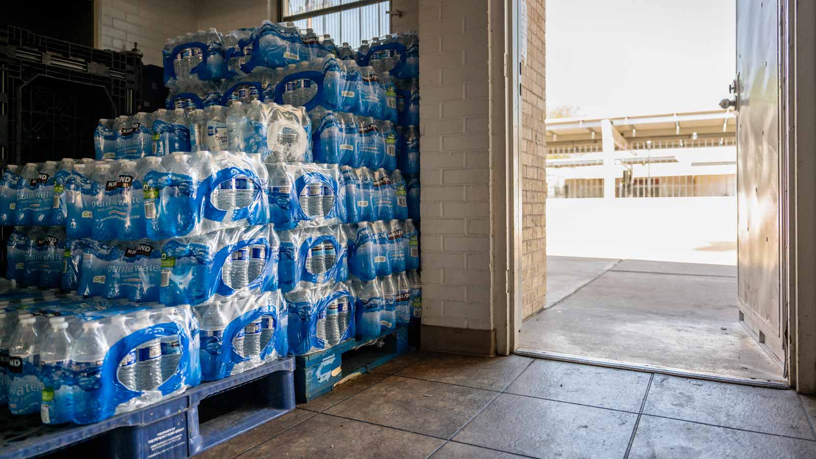 Crates of bottled water are seen stacked up near the entrance of a Heat Relief Network site at Firs...