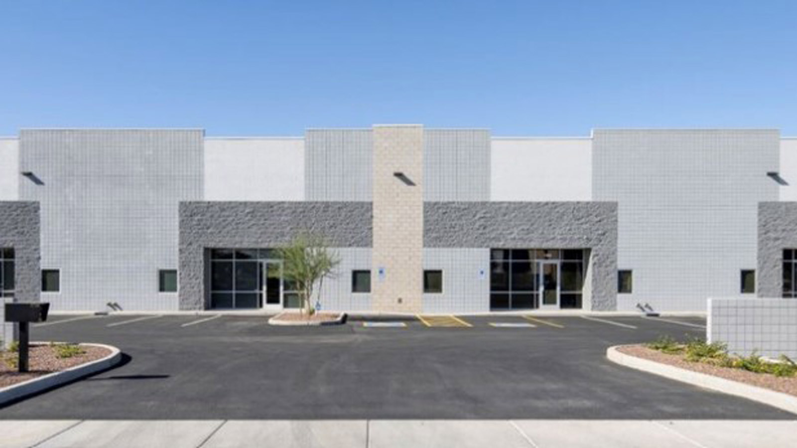 A front view of the Goodyear industrial building recently sold to Packing Solutions for Any Product...