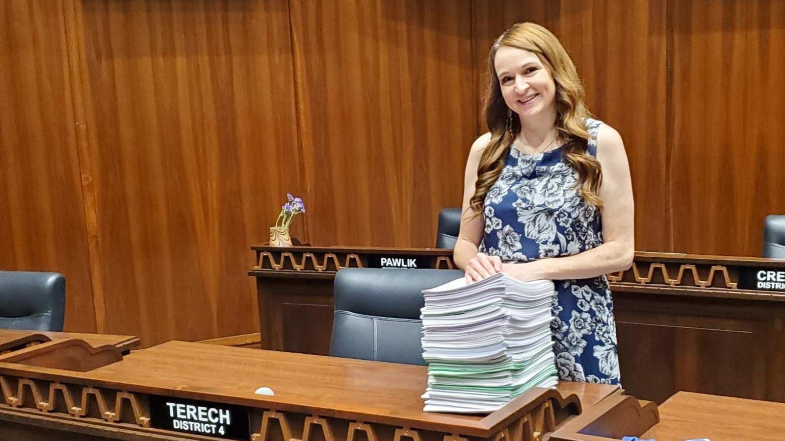 Laura Terech stands next to a stack of papers in the Arizona House of Representatives. The Democrat...