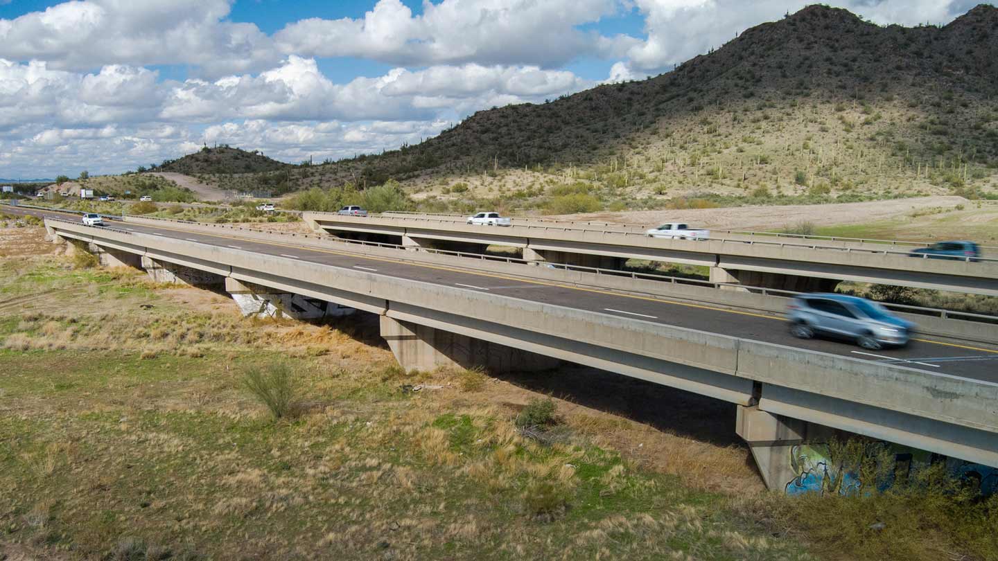 Vehicles travel across and Arizona freeway bridge. Fourth of July weekend travelers don't have to w...